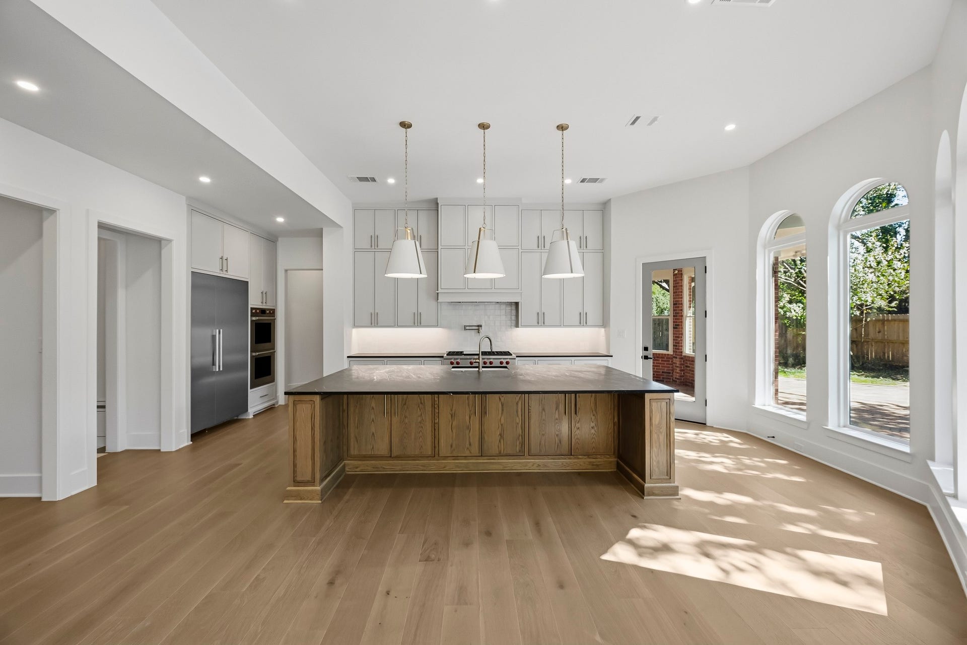 The completely redesigned kitchen offers island seating for 5!