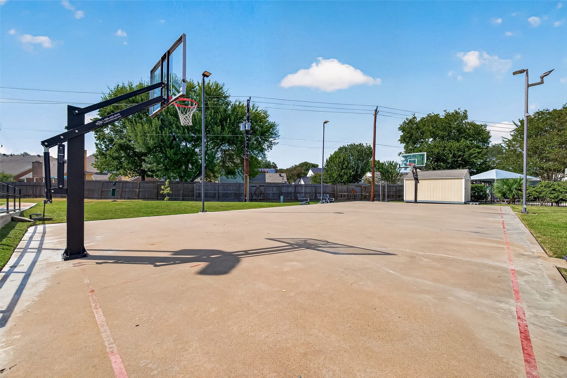 Enjoy outdoor recreation with a spacious basketball court, perfect for sports enthusiasts and family fun.
