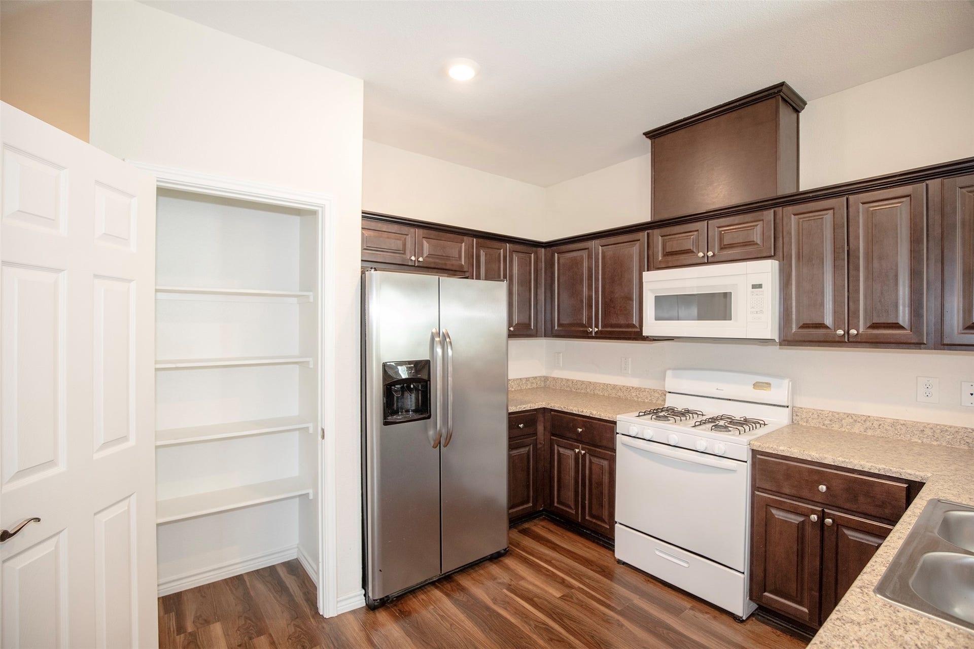 The kitchen boasts a large pantry.