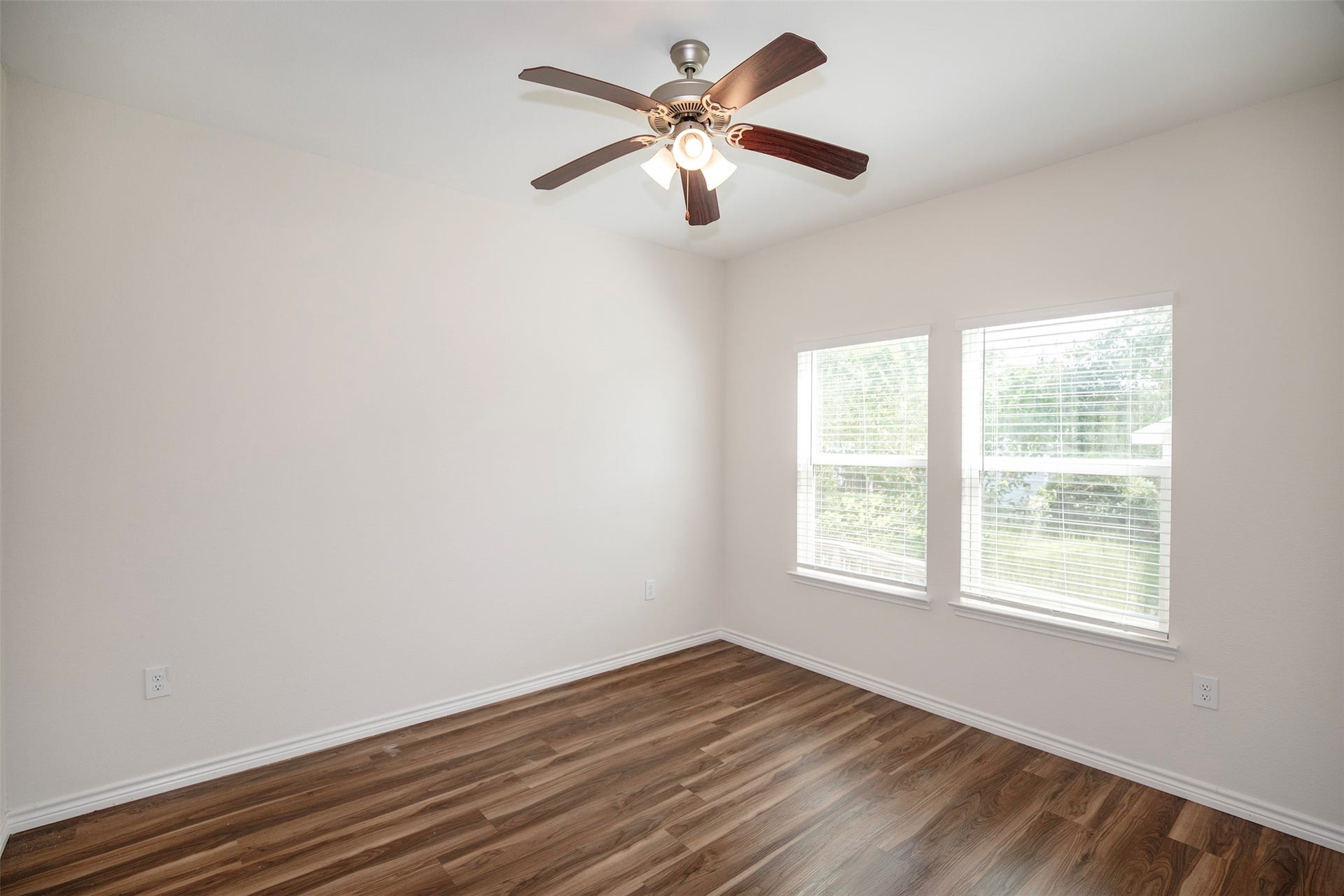 The primary bedroom has enough space for king size furniture.