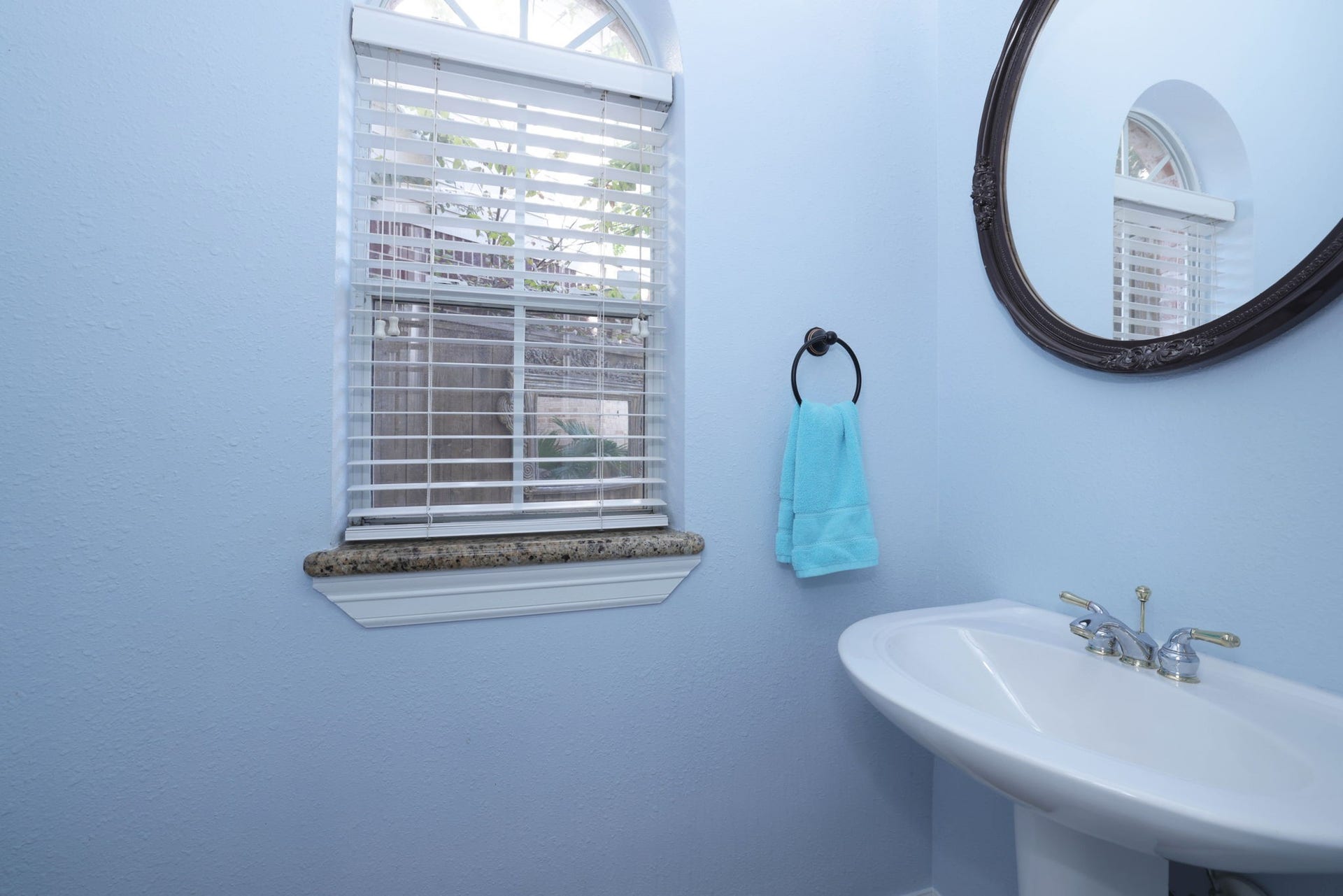 18302 Rittenhouse Park Court, Spring, TX 77379 There are 2.5 baths. This is the powder room with pedistal sink. Even the commode is new!