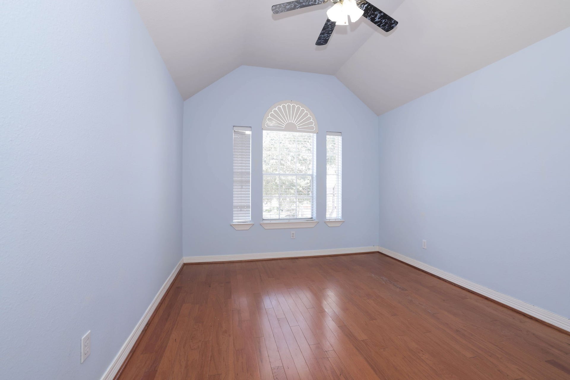 18302 Rittenhouse Park Court, Spring, TX 77379 Bedroom 2 is upstairs and has soaring ceiling and hardwood floors that run throughout the second floor.