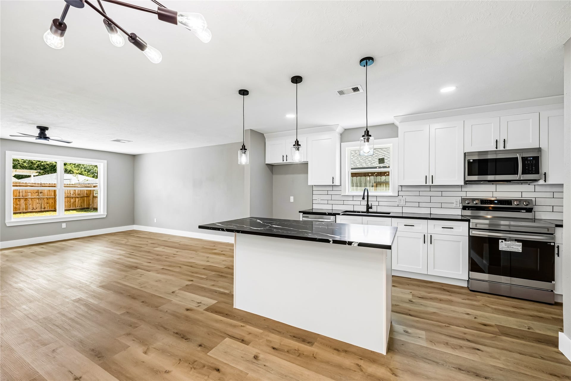 1803 Thornbrook Drive, Missouri City, TX 77489 The open layout connects seamlessly to the living area, creating a bright and functional space ideal for cooking and entertaining.