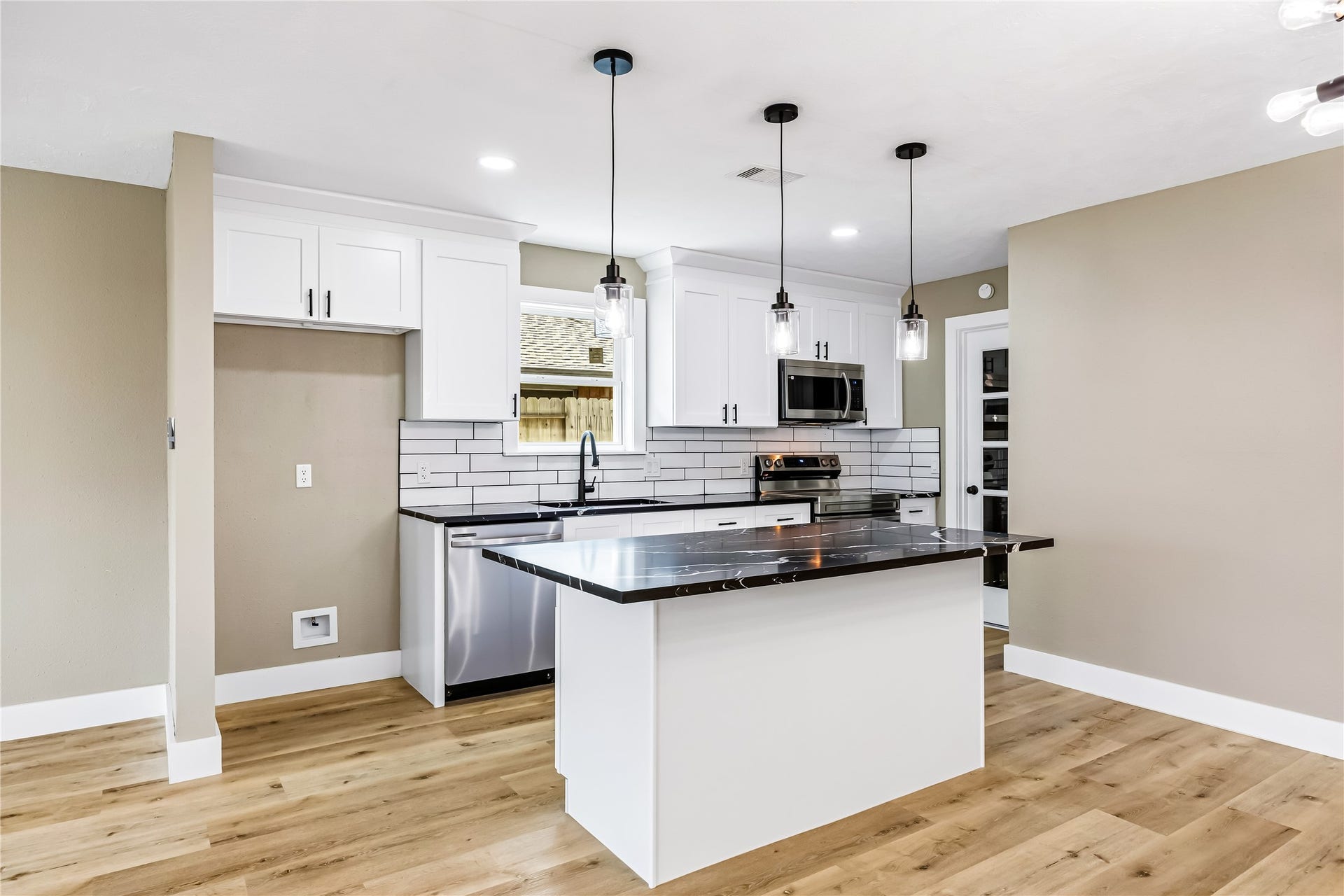 1803 Thornbrook Drive, Missouri City, TX 77489 The open layout offers generous counter space and a stylish, functional setting for cooking, dining, and entertaining.