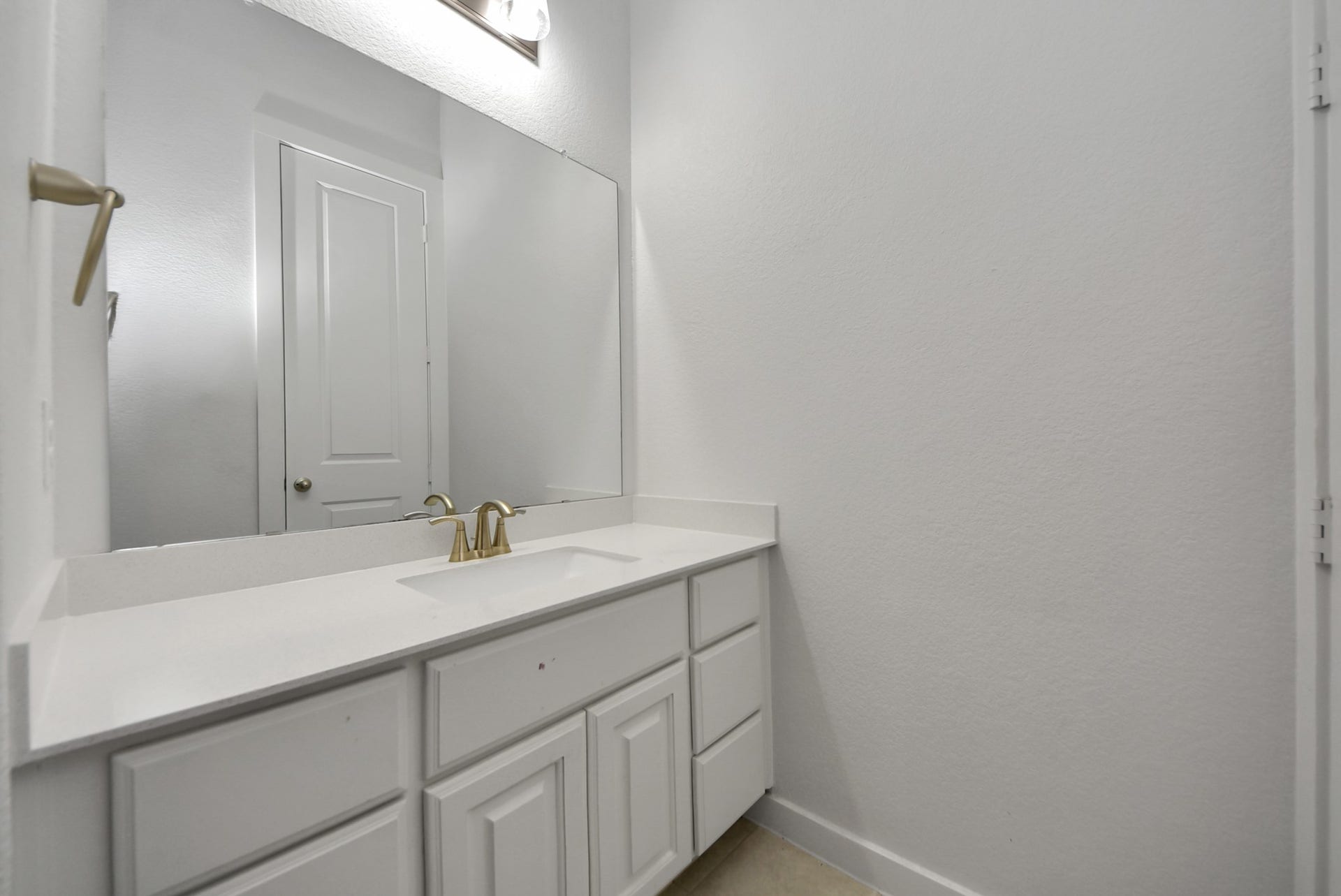 10014 Galileo Lane, Iowa Colony, TX 77583 Beautiful bathroom vanity with ample cabinetry and a large mirror.