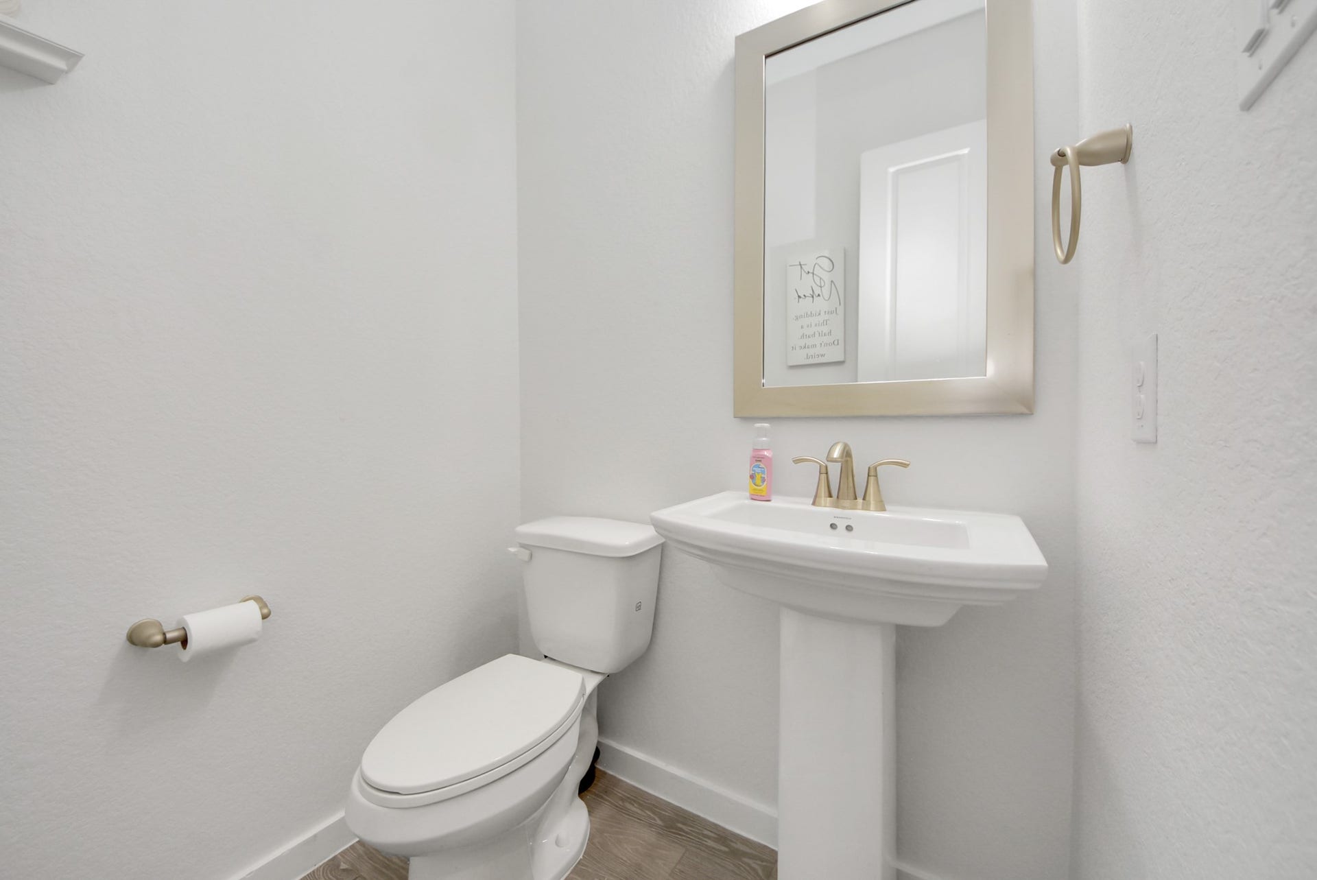 10014 Galileo Lane, Iowa Colony, TX 77583 Convenient half bathroom featuring a pedestal sink and neutral finishes.