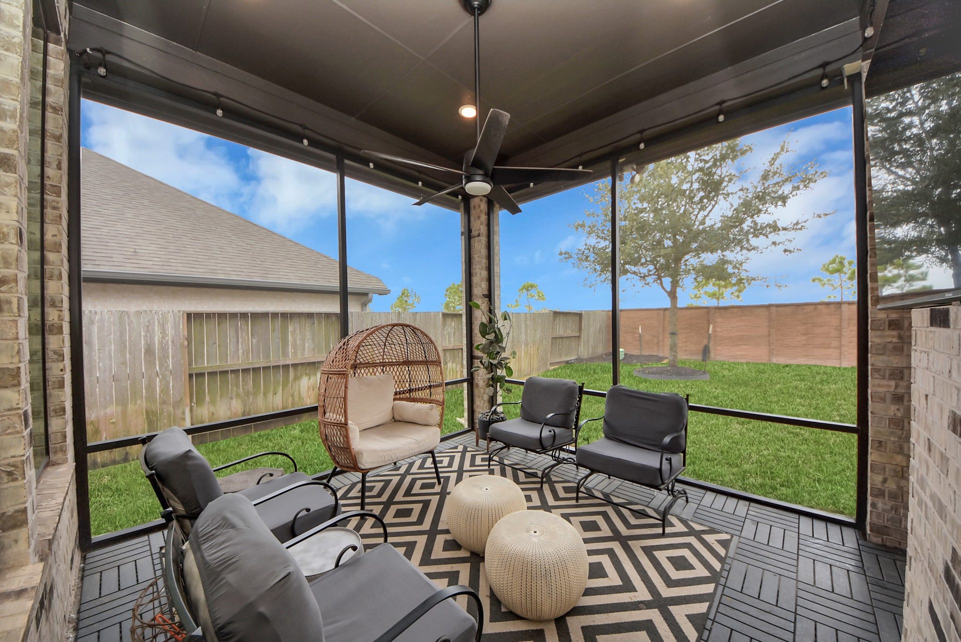 10014 Galileo Lane, Iowa Colony, TX 77583 Inviting covered patio offering a comfortable space for outdoor relaxation and entertaining.