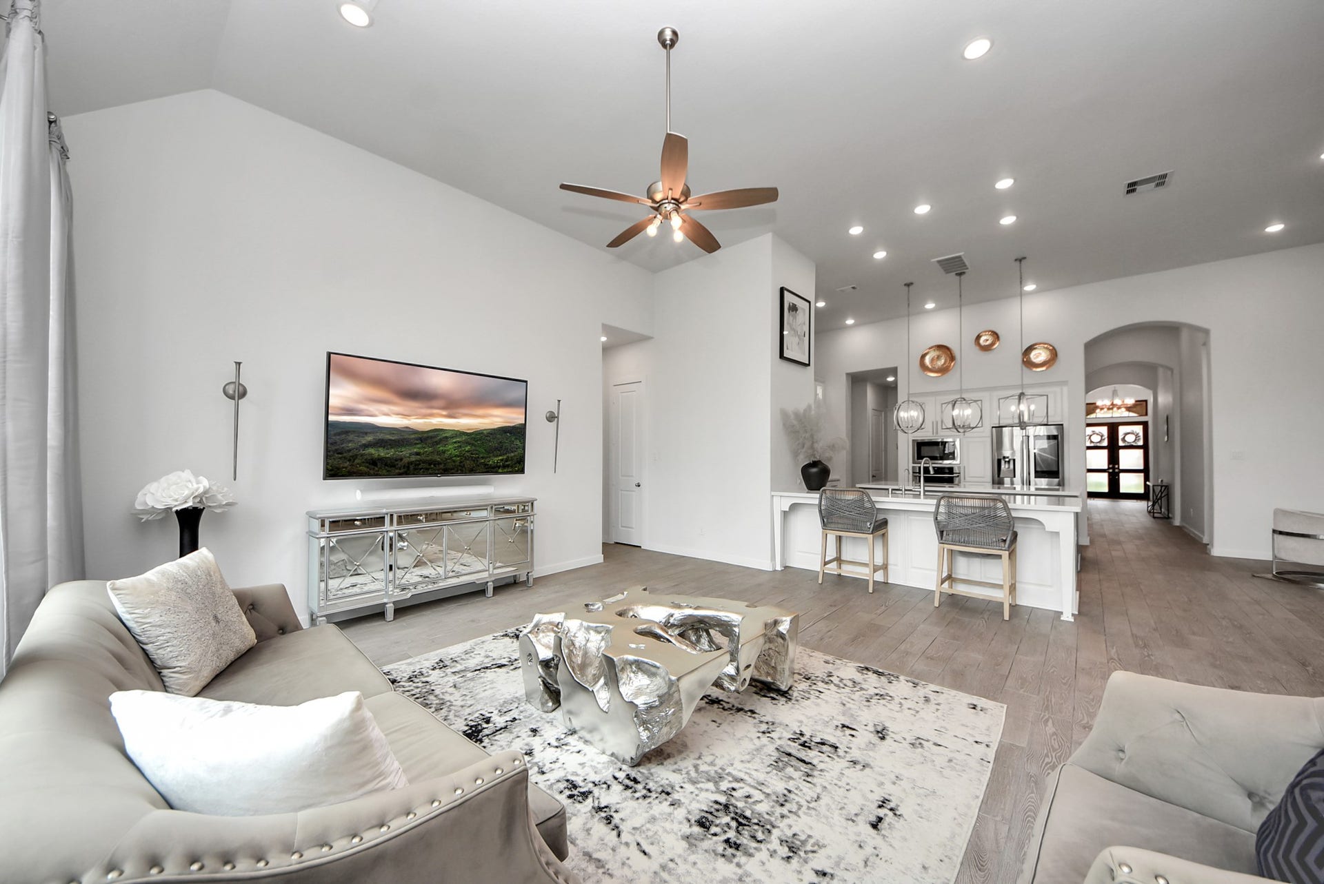 10014 Galileo Lane, Iowa Colony, TX 77583 Spacious living room with high ceilings and an open layout ideal for entertaining.