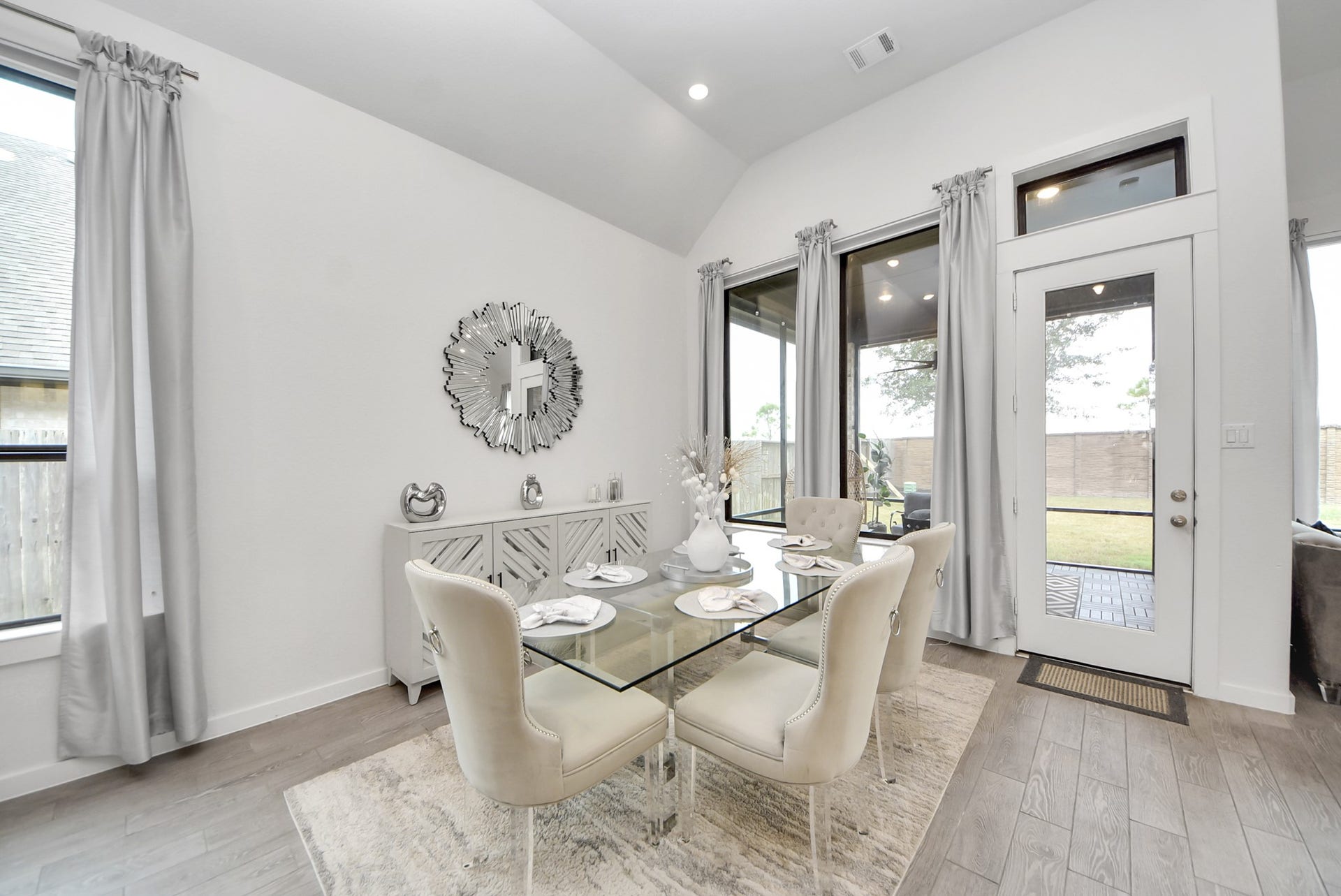 10014 Galileo Lane, Iowa Colony, TX 77583 Bright dining area with large windows and an inviting atmosphere.