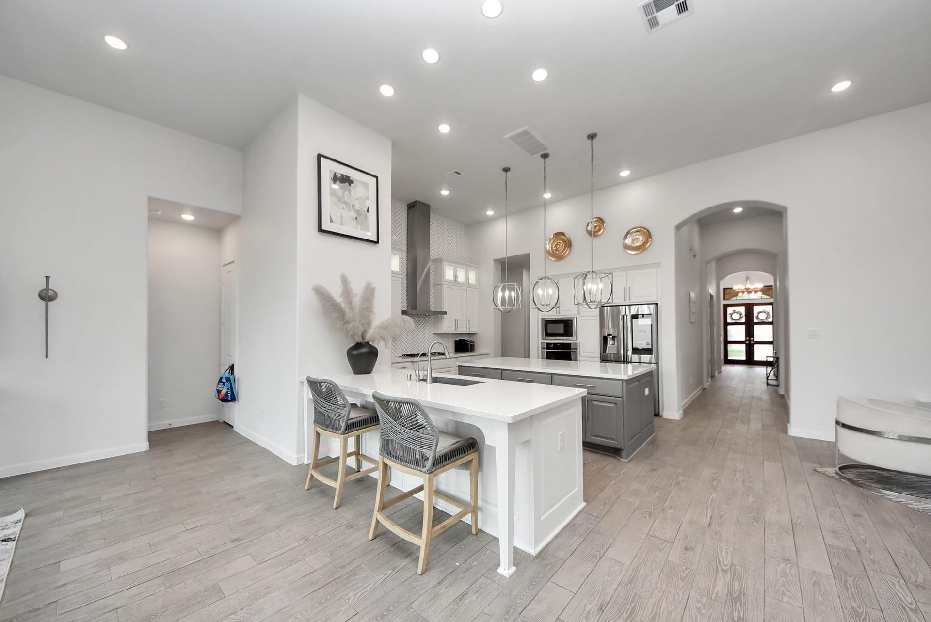 10014 Galileo Lane, Iowa Colony, TX 77583 Bright dining and kitchen area featuring an open layout and contemporary finishes.