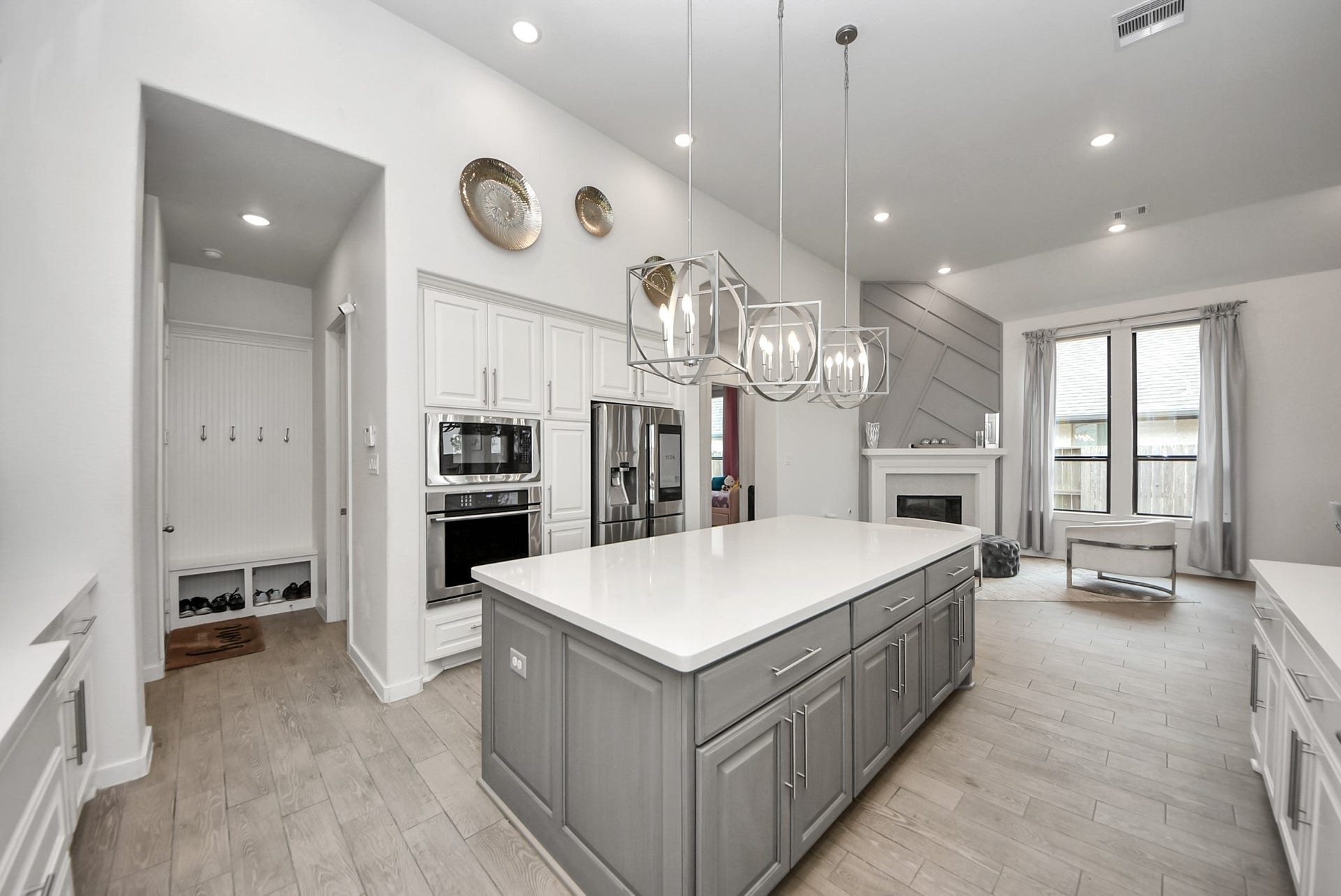 10014 Galileo Lane, Iowa Colony, TX 77583 Gorgeous kitchen featuring a large center island, modern cabinetry, and pendant lighting.