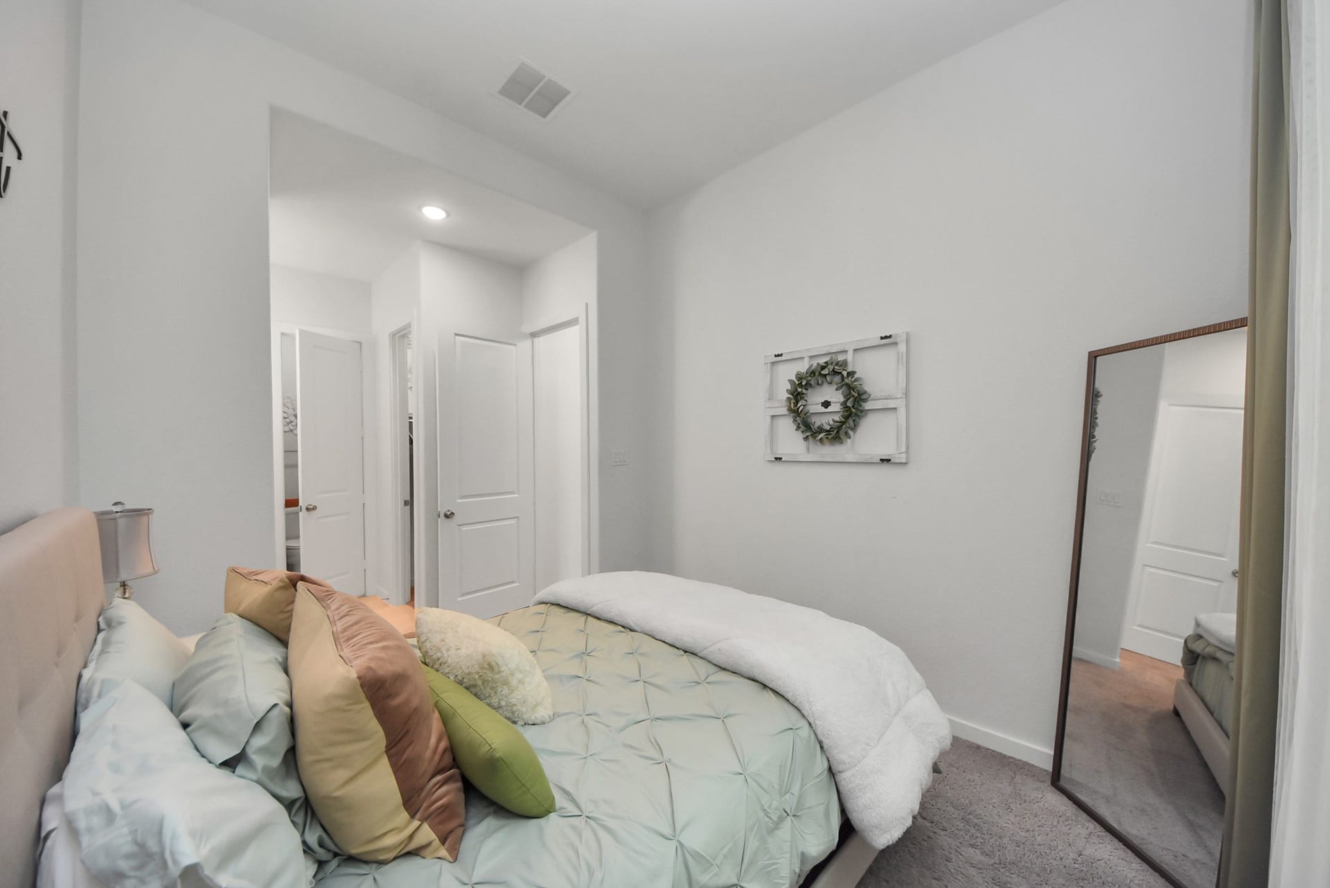 10014 Galileo Lane, Iowa Colony, TX 77583 Comfortable bedroom featuring soft neutral tones and natural light.