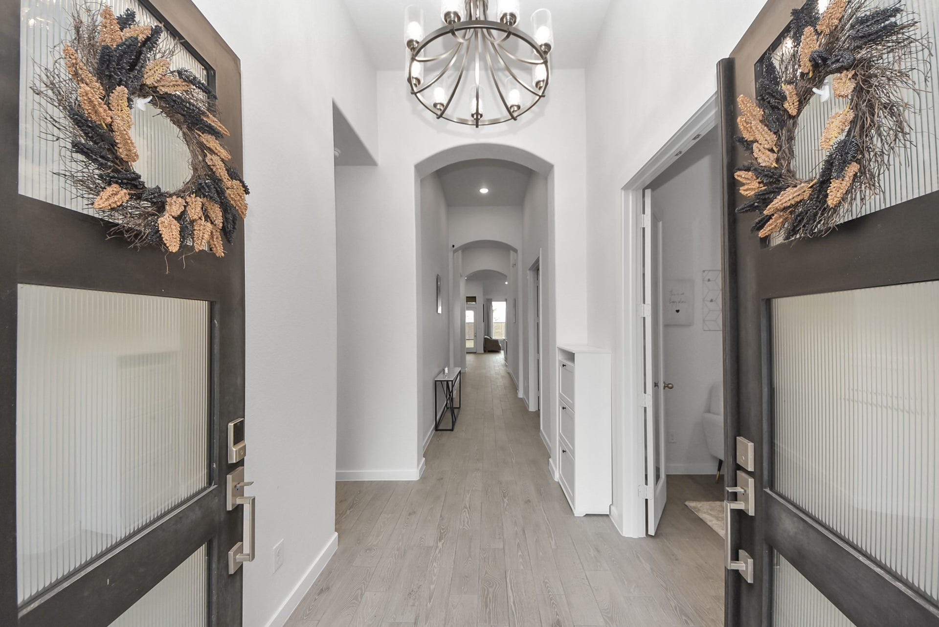 10014 Galileo Lane, Iowa Colony, TX 77583 Elegant entryway featuring a welcoming foyer and decorative architectural details.