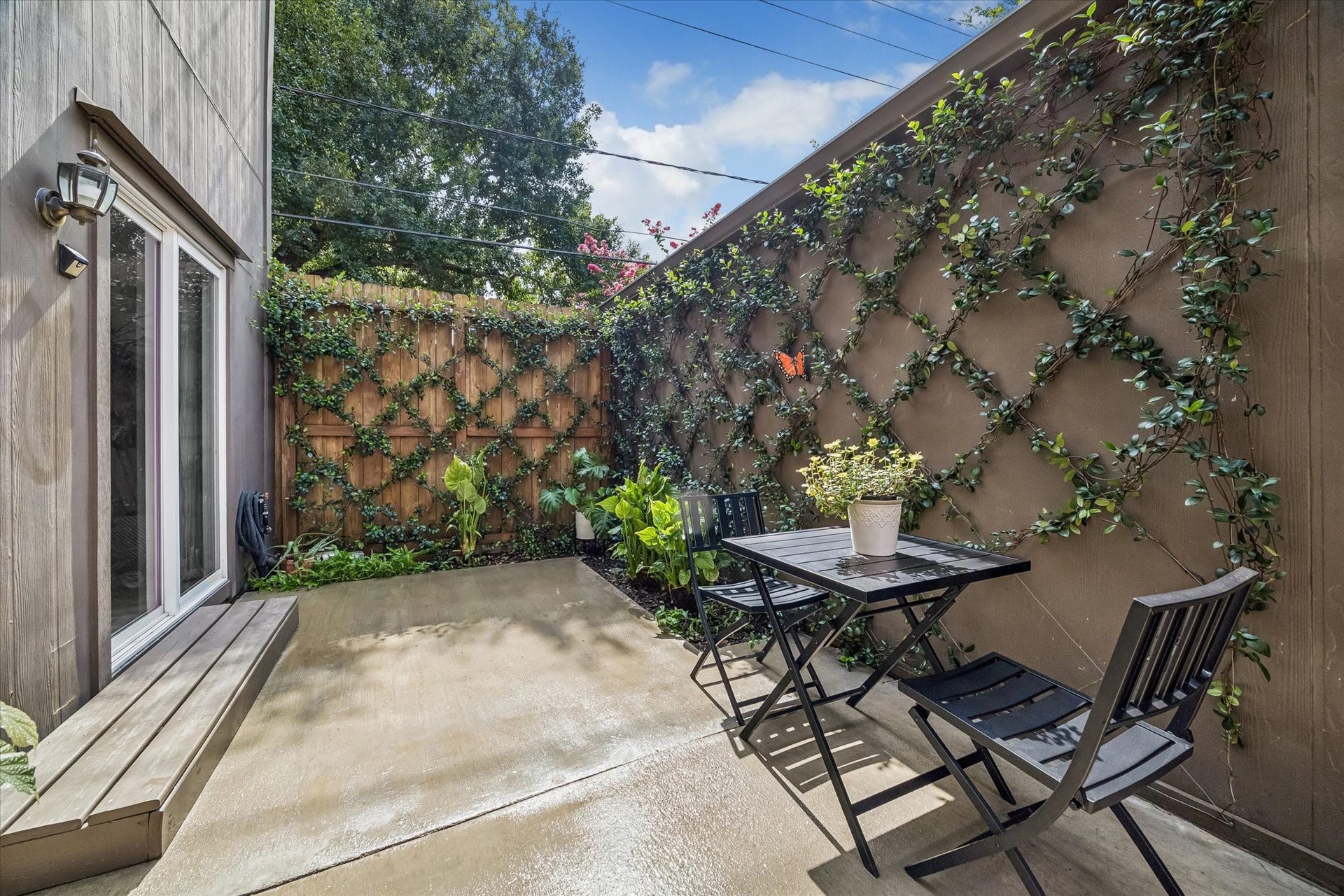 New patio flooring, new fencing, and professional landscape.