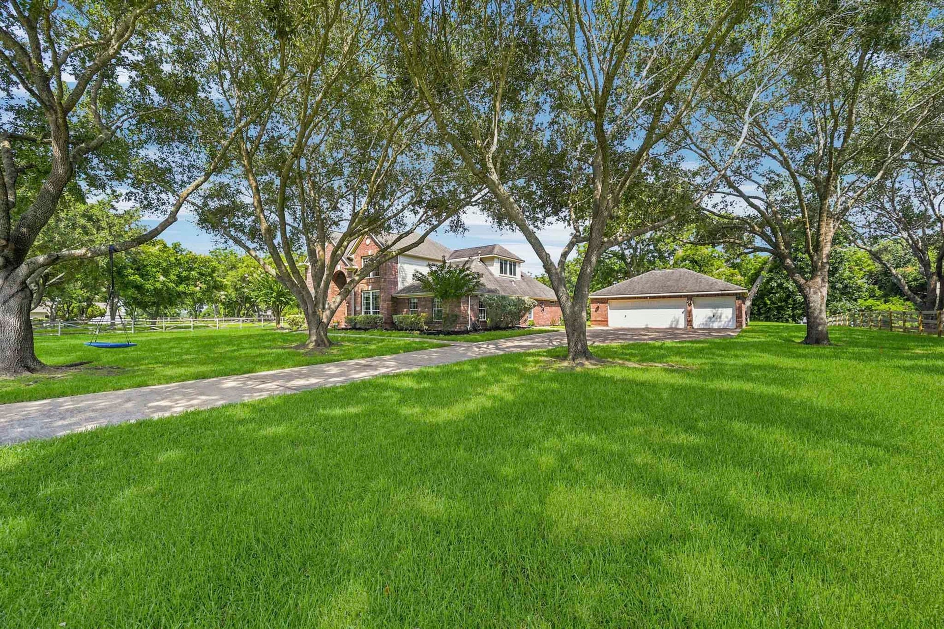 5202 Cherry Ridge Road, Richmond, TX 77406 Oversized 3-car garage featuring a dedicated workshop area.