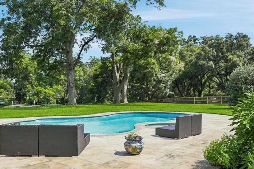 5202 Cherry Ridge Road, Richmond, TX 77406 Relax in this large, heated pool and hot tub with tons of room for entertaining