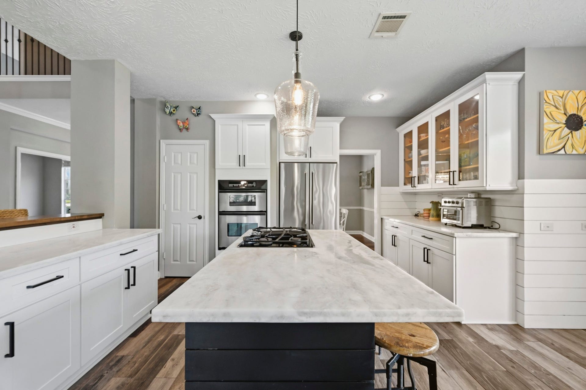 5202 Cherry Ridge Road, Richmond, TX 77406 Well-appointed kitchen featuring marble countertops, extensive workspace, and soft-close cabinetry.