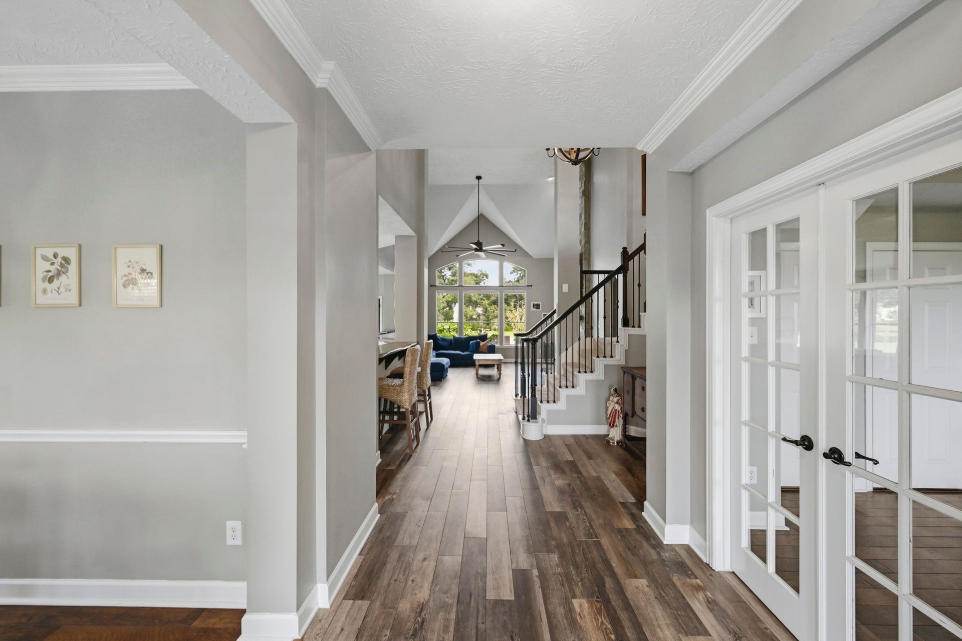 5202 Cherry Ridge Road, Richmond, TX 77406 Elegant entry showcasing the formal dining room, study, and exquisite architectural details.