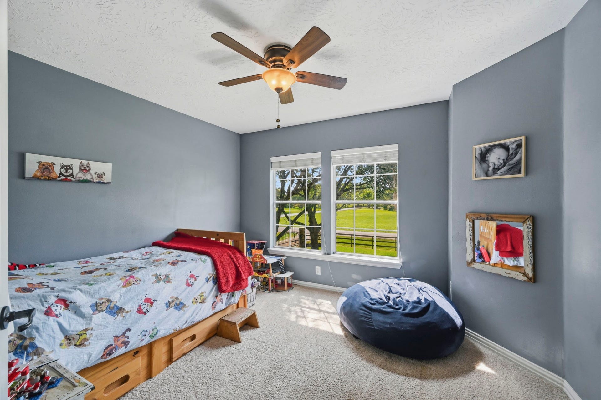 5202 Cherry Ridge Road, Richmond, TX 77406 Secondary bedroom with beautiful treetop views.
