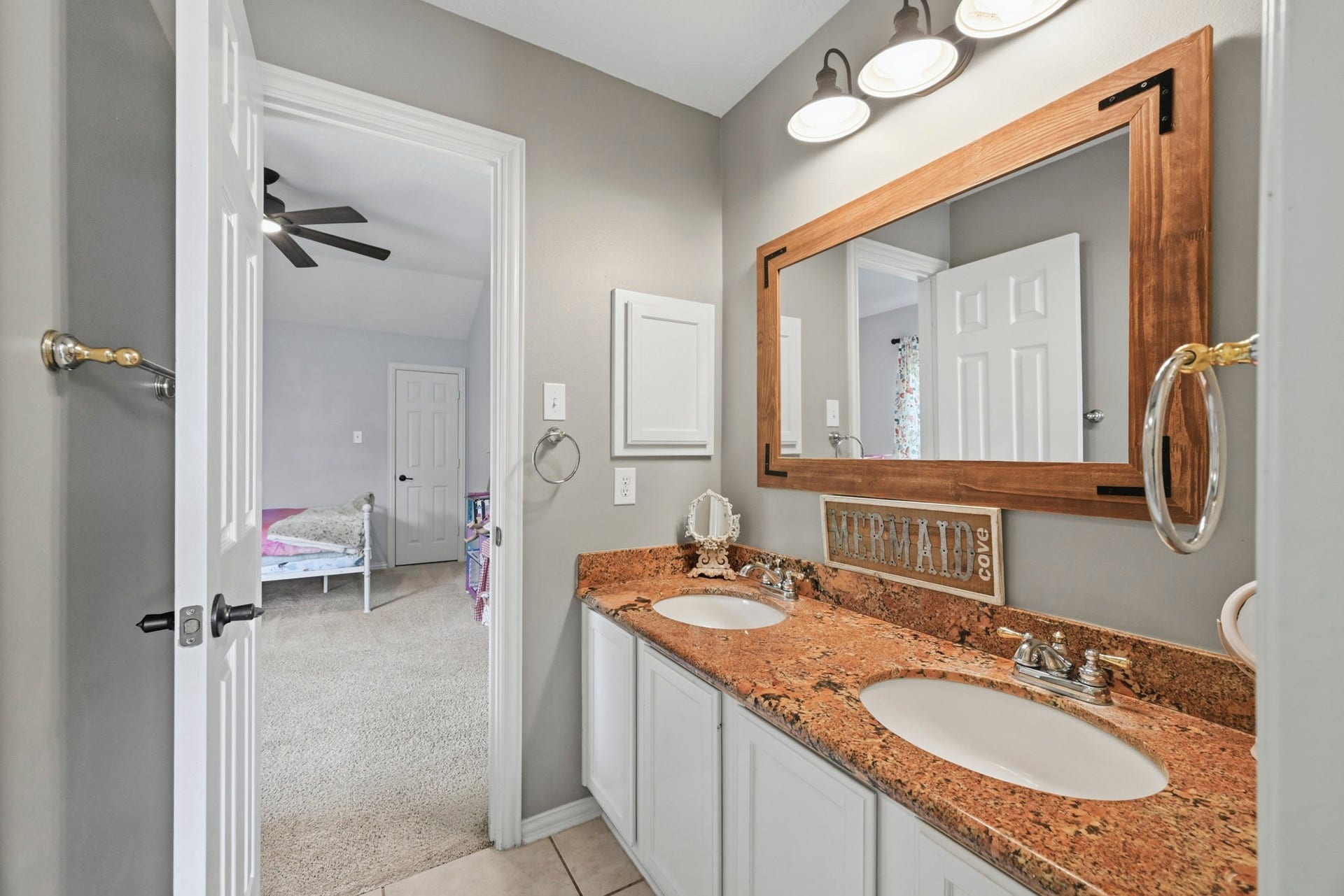 5202 Cherry Ridge Road, Richmond, TX 77406 Secondary bath featuring dual vanities and ample counter space.