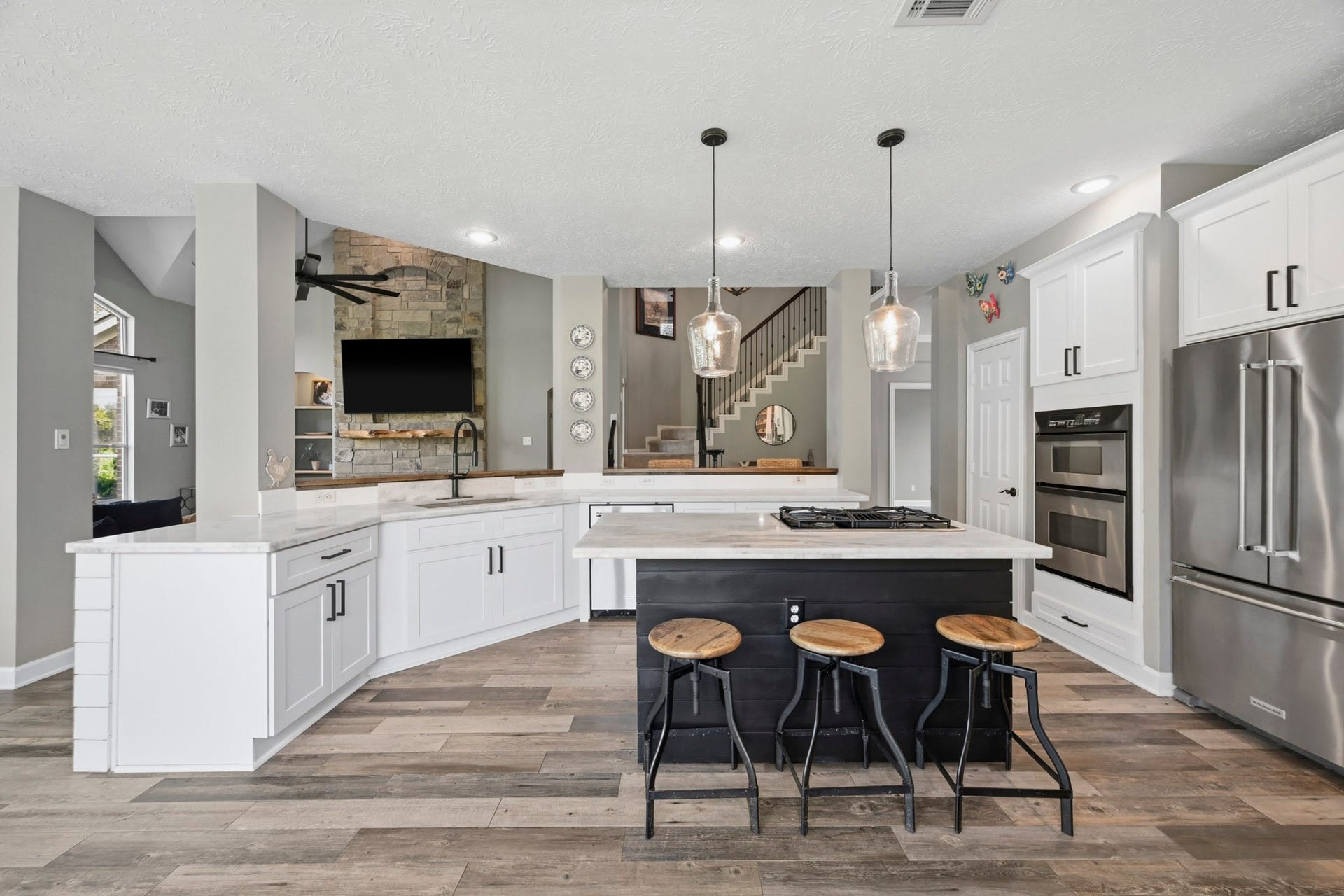 5202 Cherry Ridge Road, Richmond, TX 77406 Gourmet kitchen with large island, breakfast bar, and multiple gathering spaces for entertaining.