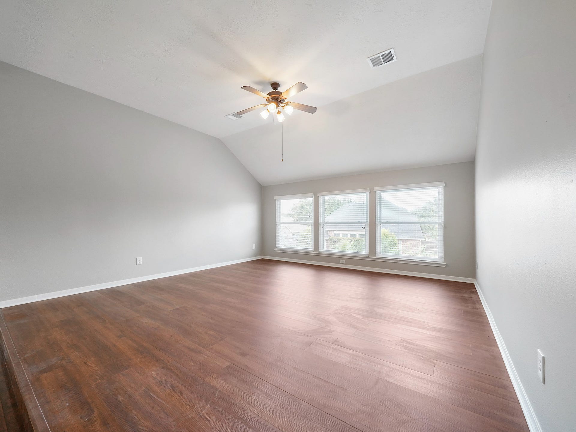 A wall of windows keeps the game room bright while its expansive layout leaves room to make it your own.