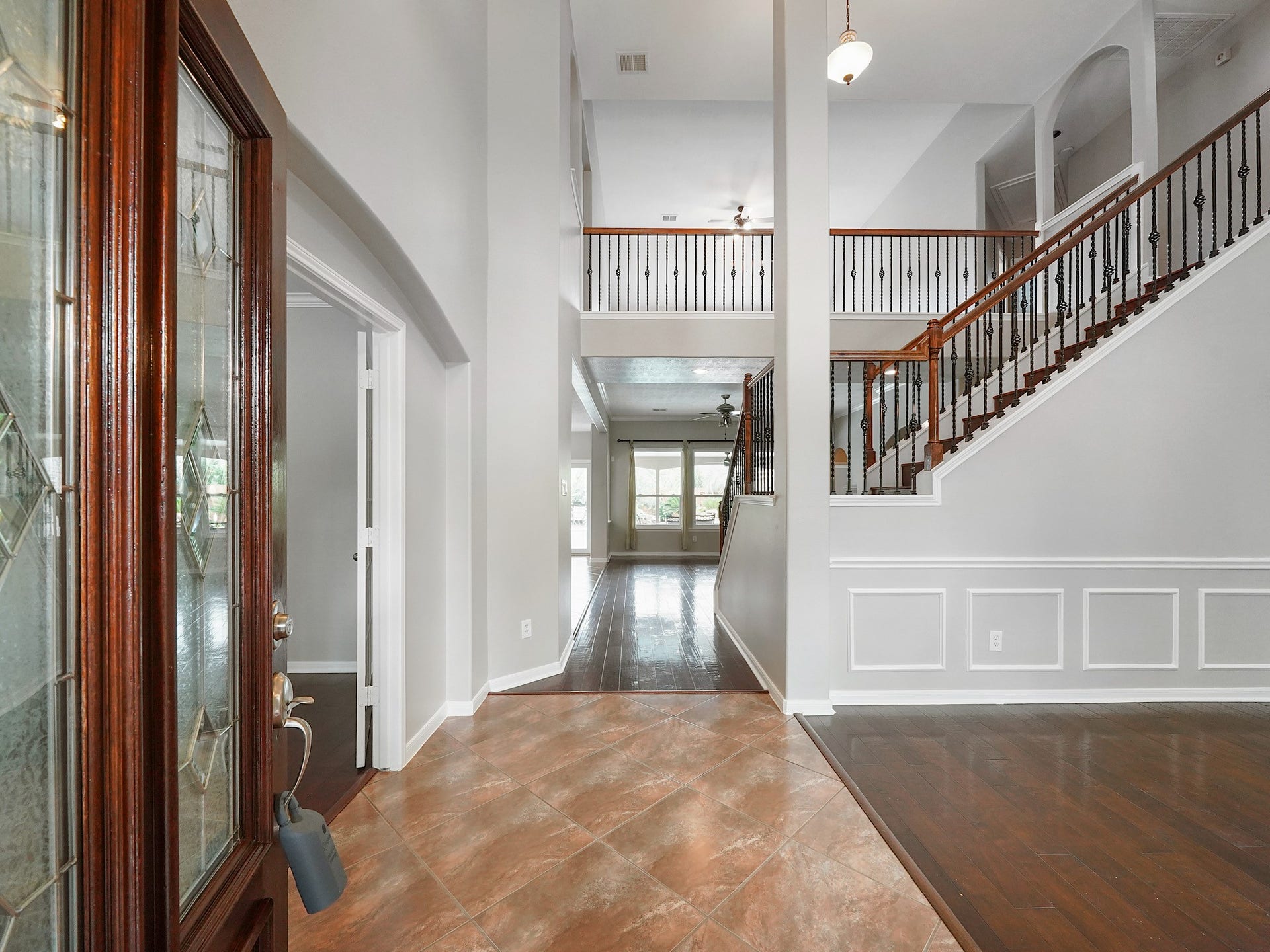 The entry welcomes you with fresh paint, rich wood floors, classic millwork, and an effortless flow into the home.