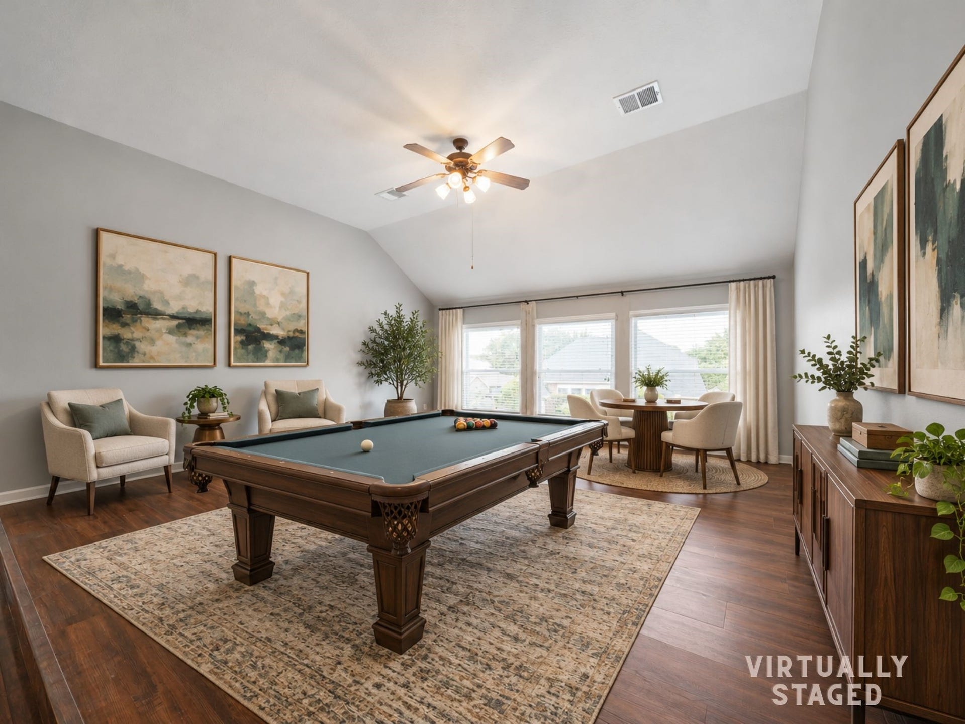Virtually staged: The game room is set up for true fun, with space for a pool table, conversation seating, and casual game nights.