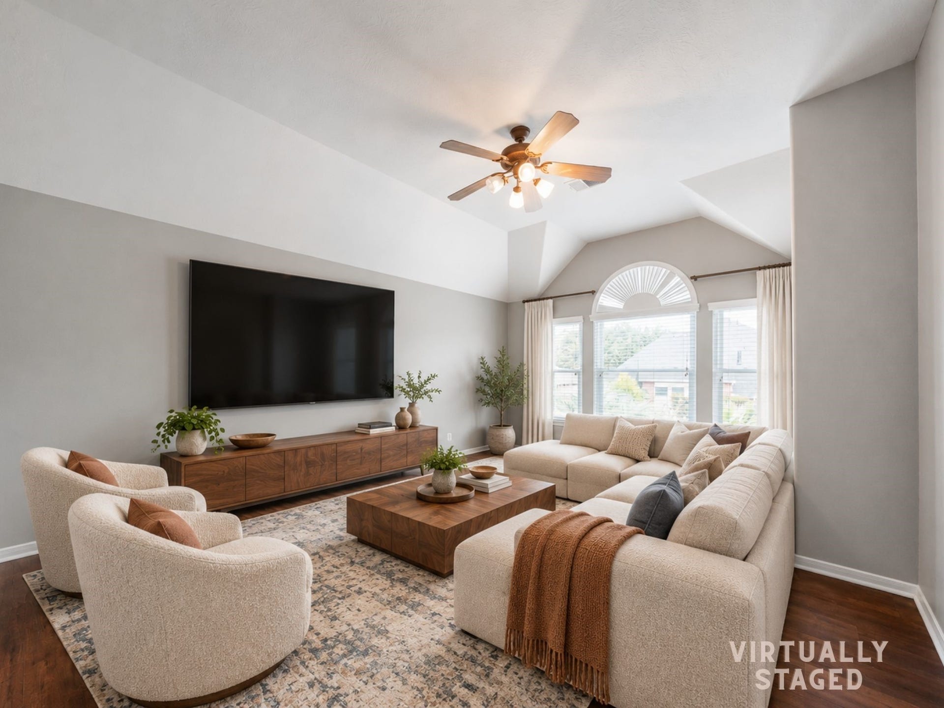 Virtually staged: Designed as a media room, this spacious retreat offers a large TV wall, comfortable seating, and a relaxed setting for movie nights and weekend watching.