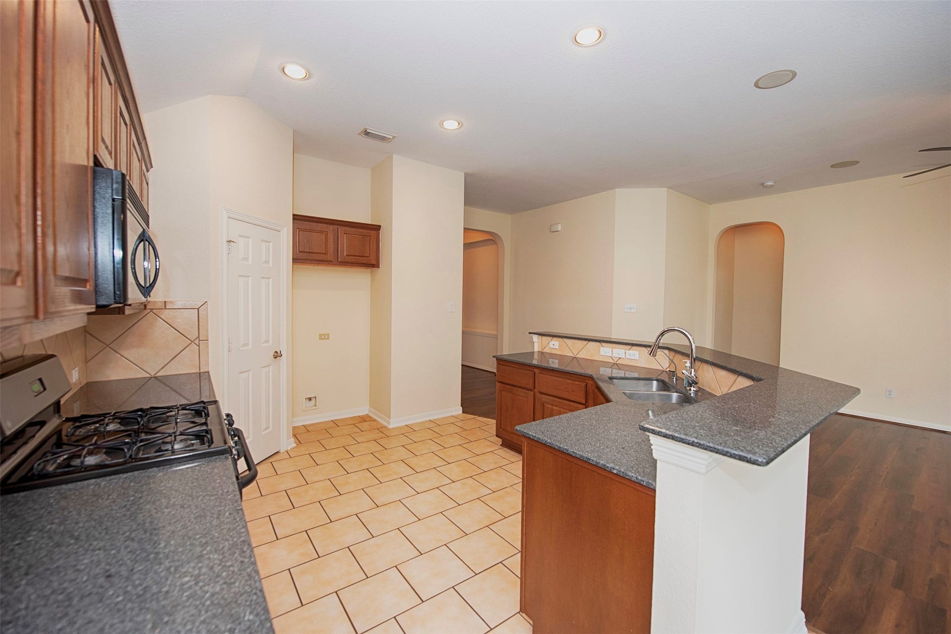 A view of the kitchen as you approach the casual dining room.