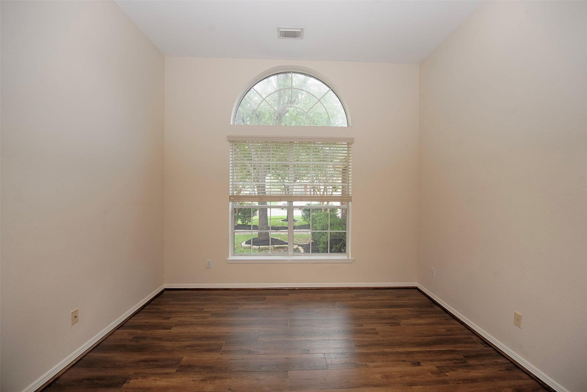 At the front of the home through double doors is a large home office.