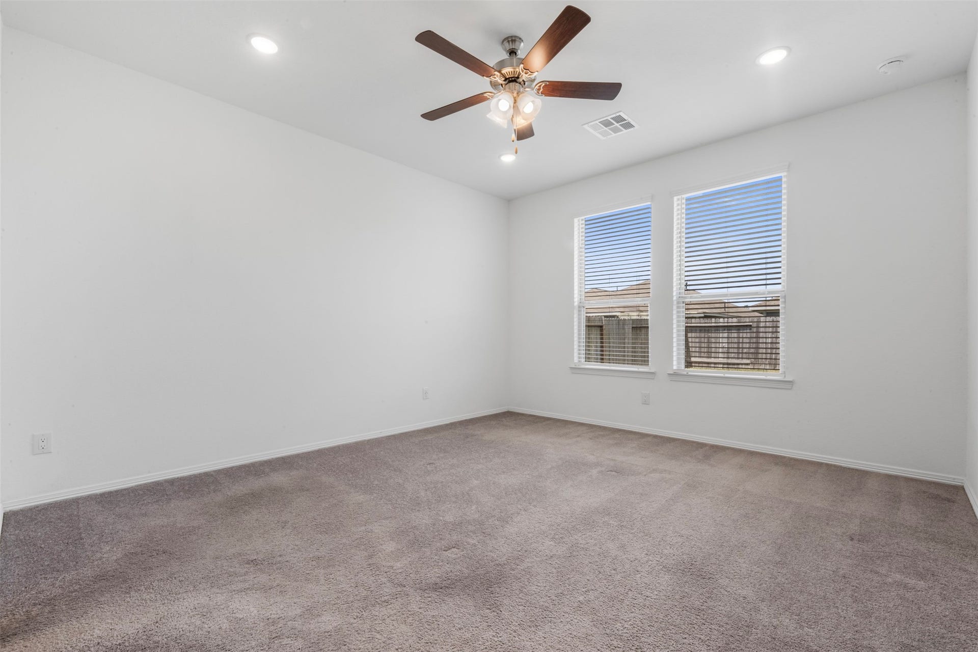 25814 Northpark Pine Drive, Porter, TX 77365 Primary bedroom with blinds and ceiling fan is ready for your design touch!