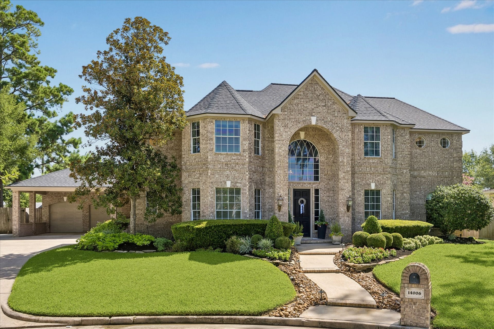 Welcome HOME to 14006 Pegasus Circle. Timeless architecture, lush landscaping, and undeniable curb appeal create a first impression that hints at the elegance waiting inside.