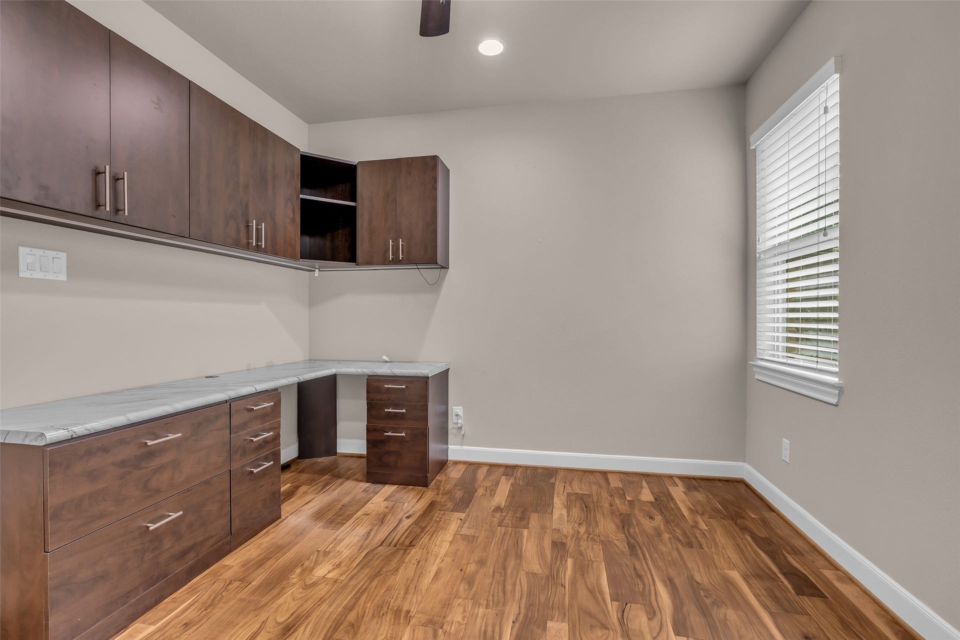 Secondary bedroom with walk in closet. Bottom cabinets have been removed.
