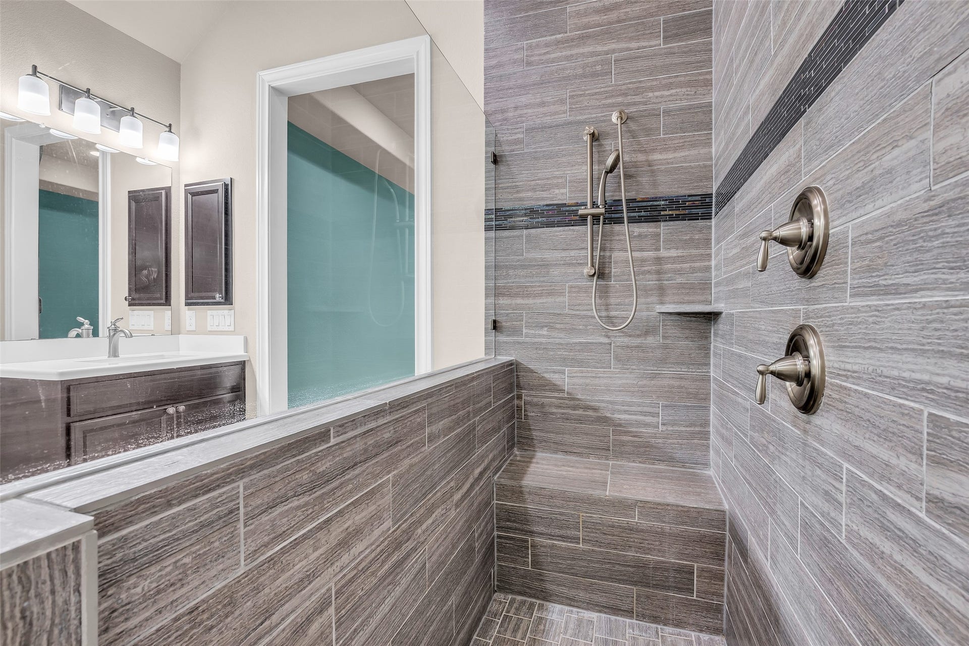 Oversized walk-in shower and double vanity sinks