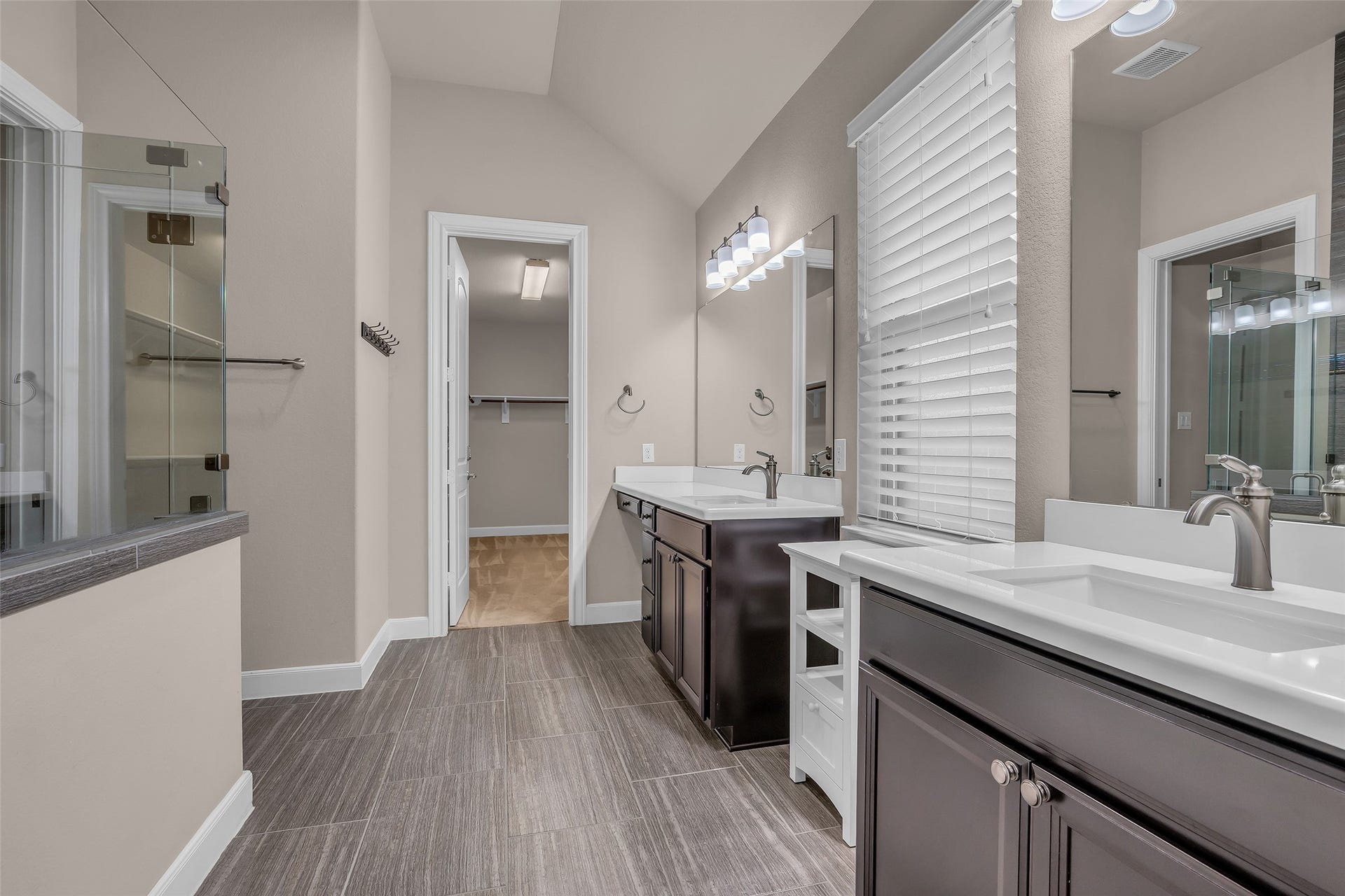 Oversized walk-in shower and double vanity sinks