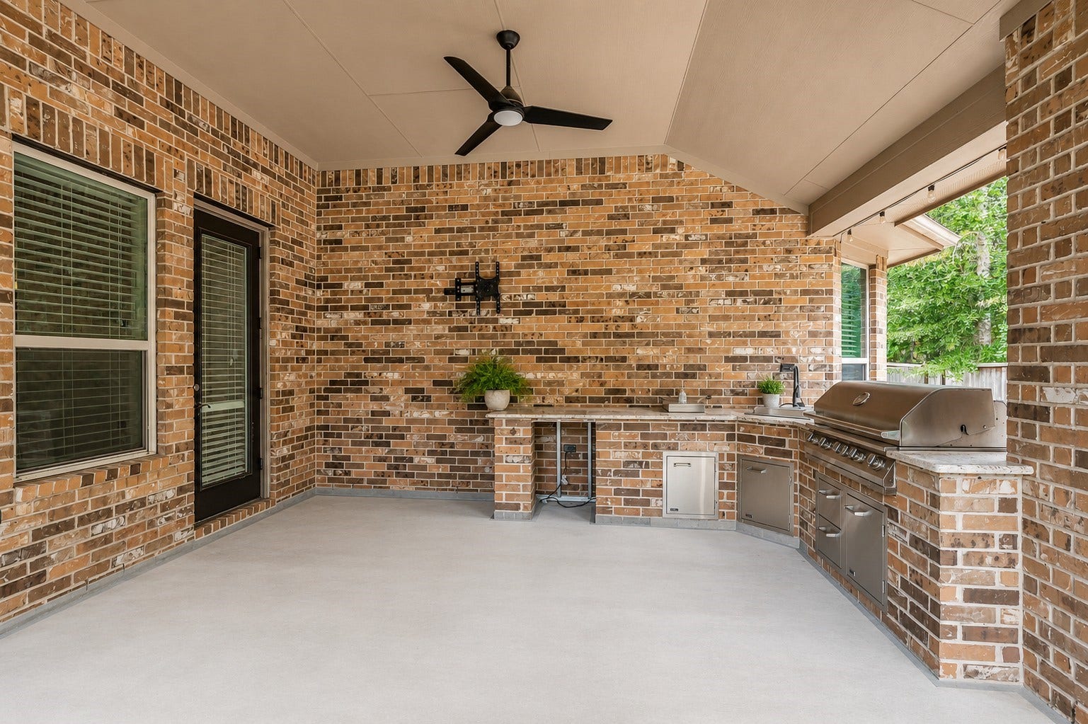 Outdoor kitchen is perfect for entertaining or relaxing. No back neighbors