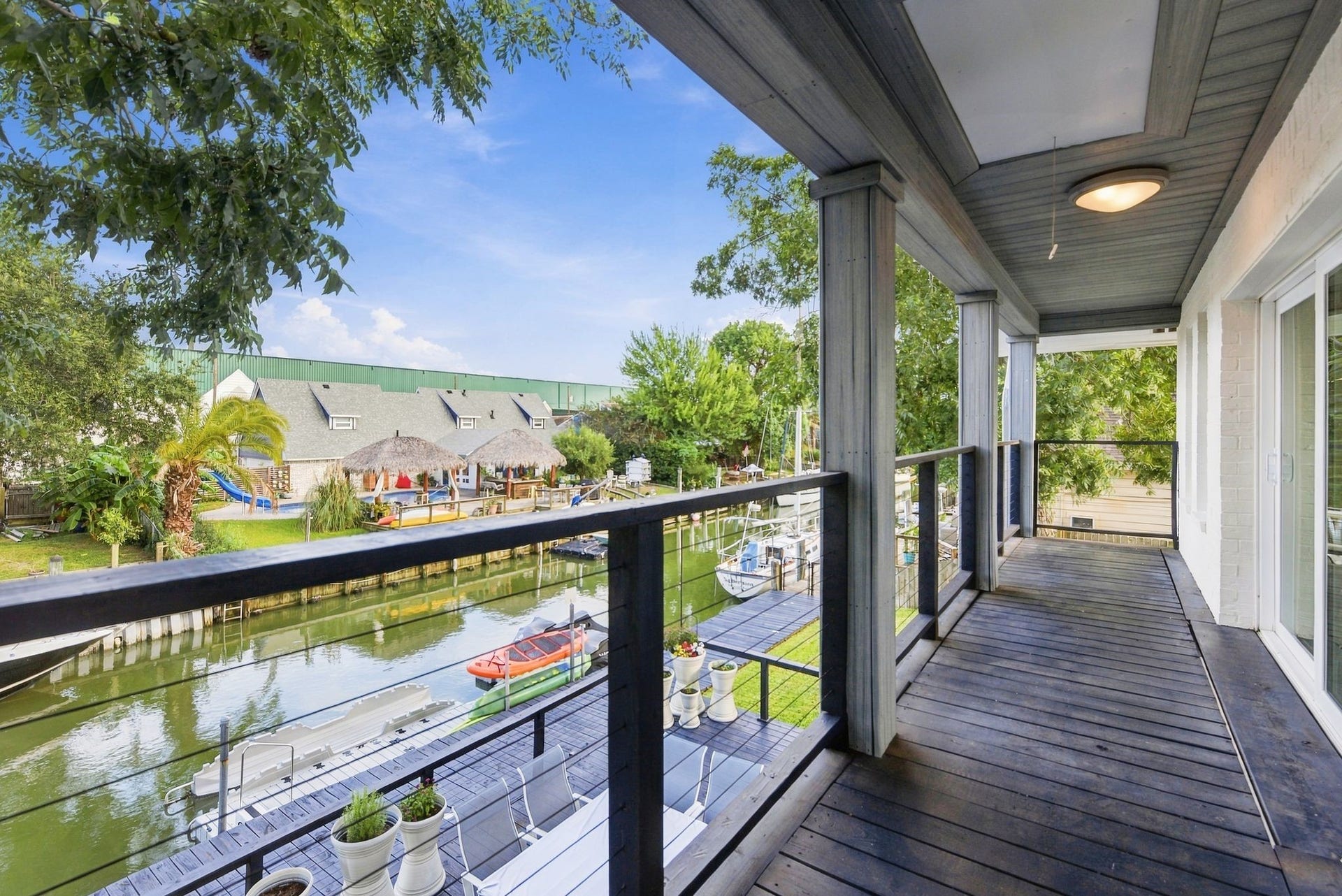 14 Harbor Lane, Kemah, TX 77565 The upstairs gameroom leads to an outside covered porch.