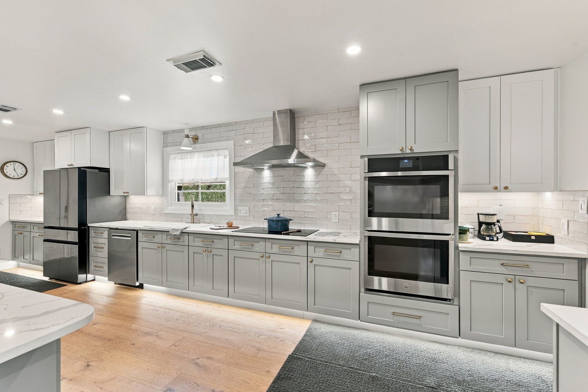 14 Harbor Lane, Kemah, TX 77565 The kitchen has top of the line appliances with double ovens, beverage refrigerator, and induction stove.