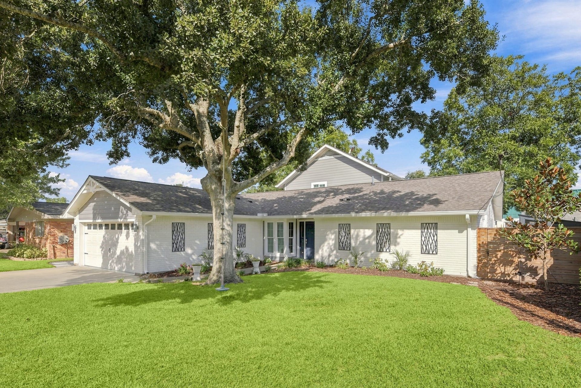 14 Harbor Lane, Kemah, TX 77565 With a nice size yard and mature oak tree.