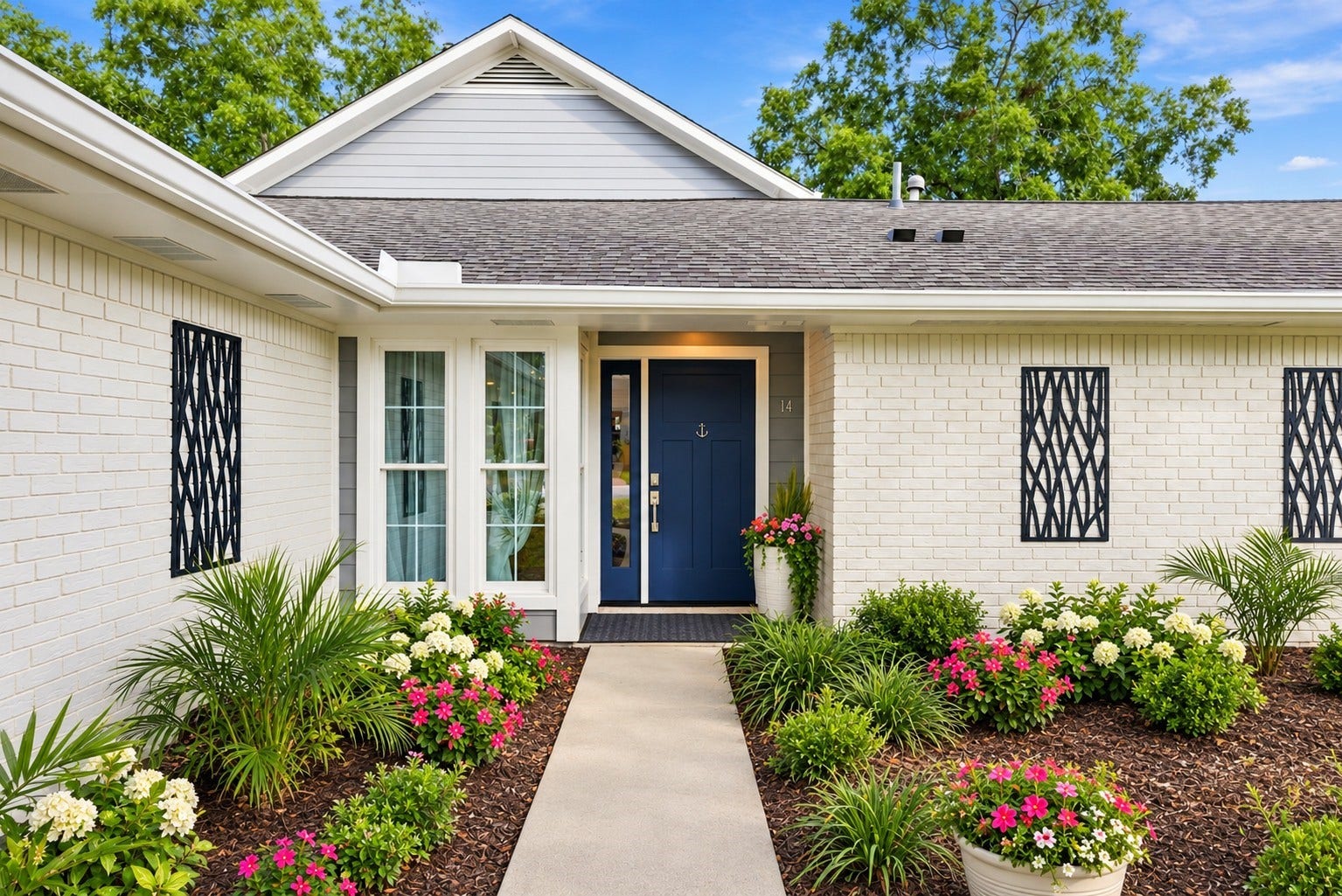 14 Harbor Lane, Kemah, TX 77565 The front of the home has a welcoming walkway.