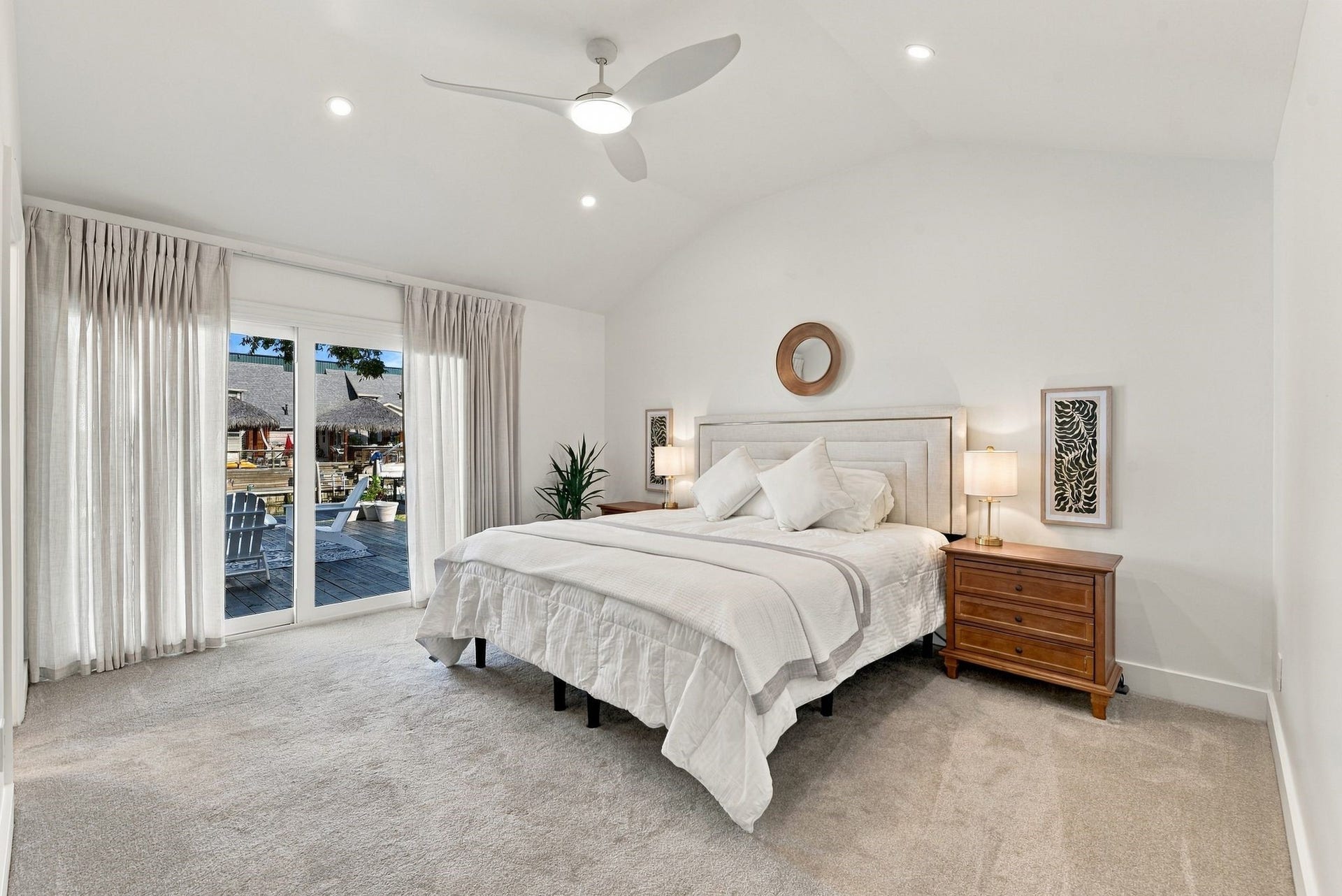 14 Harbor Lane, Kemah, TX 77565 The Primary Bedroom has vaulted ceilings and a view of the water, and is located on the first floor.