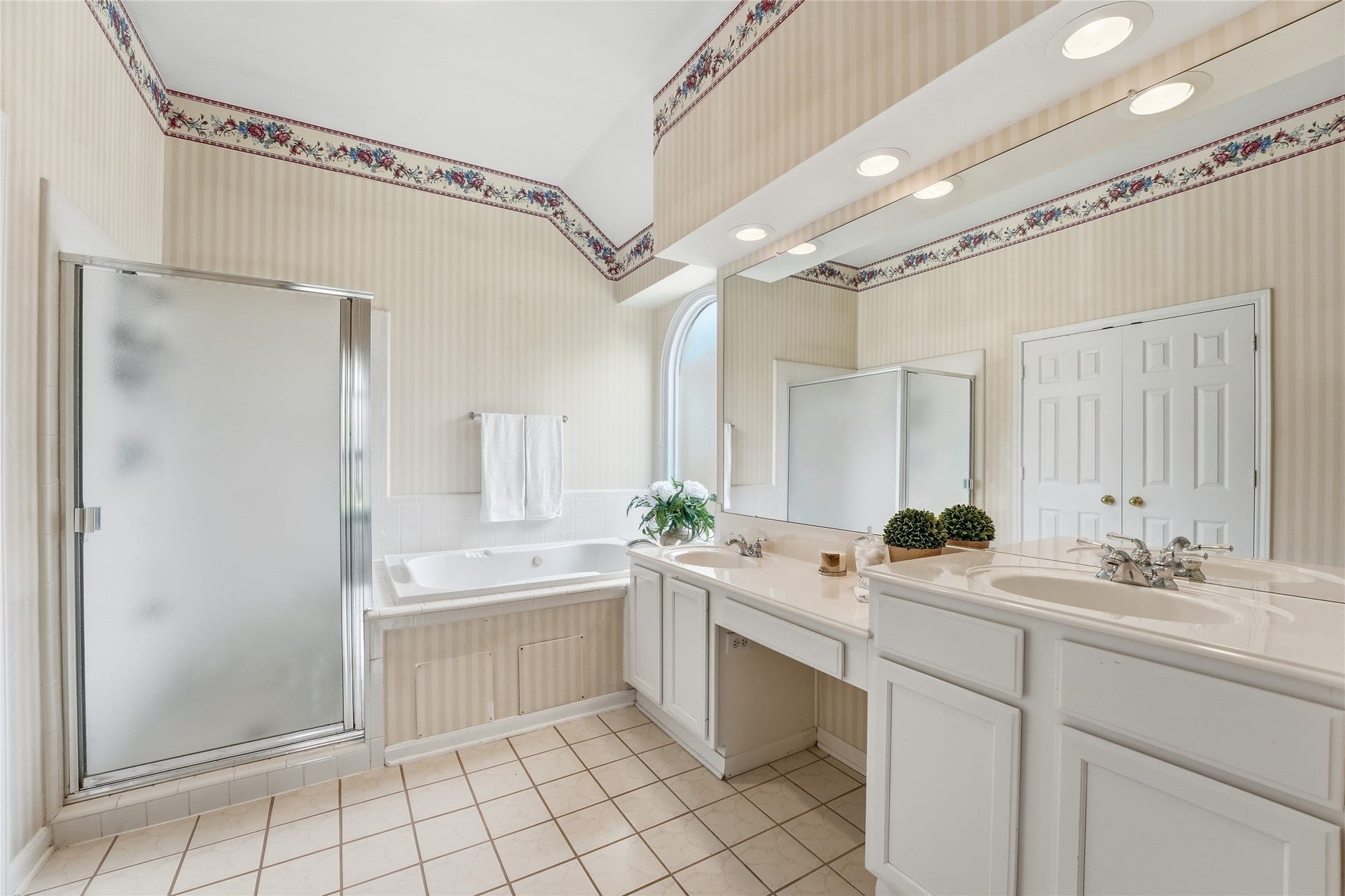 8027 Summer Brook Court, Sugar Land, TX 77479 Primary bathroom with double sinks and vanity, whirlpool tub, and separate shower.