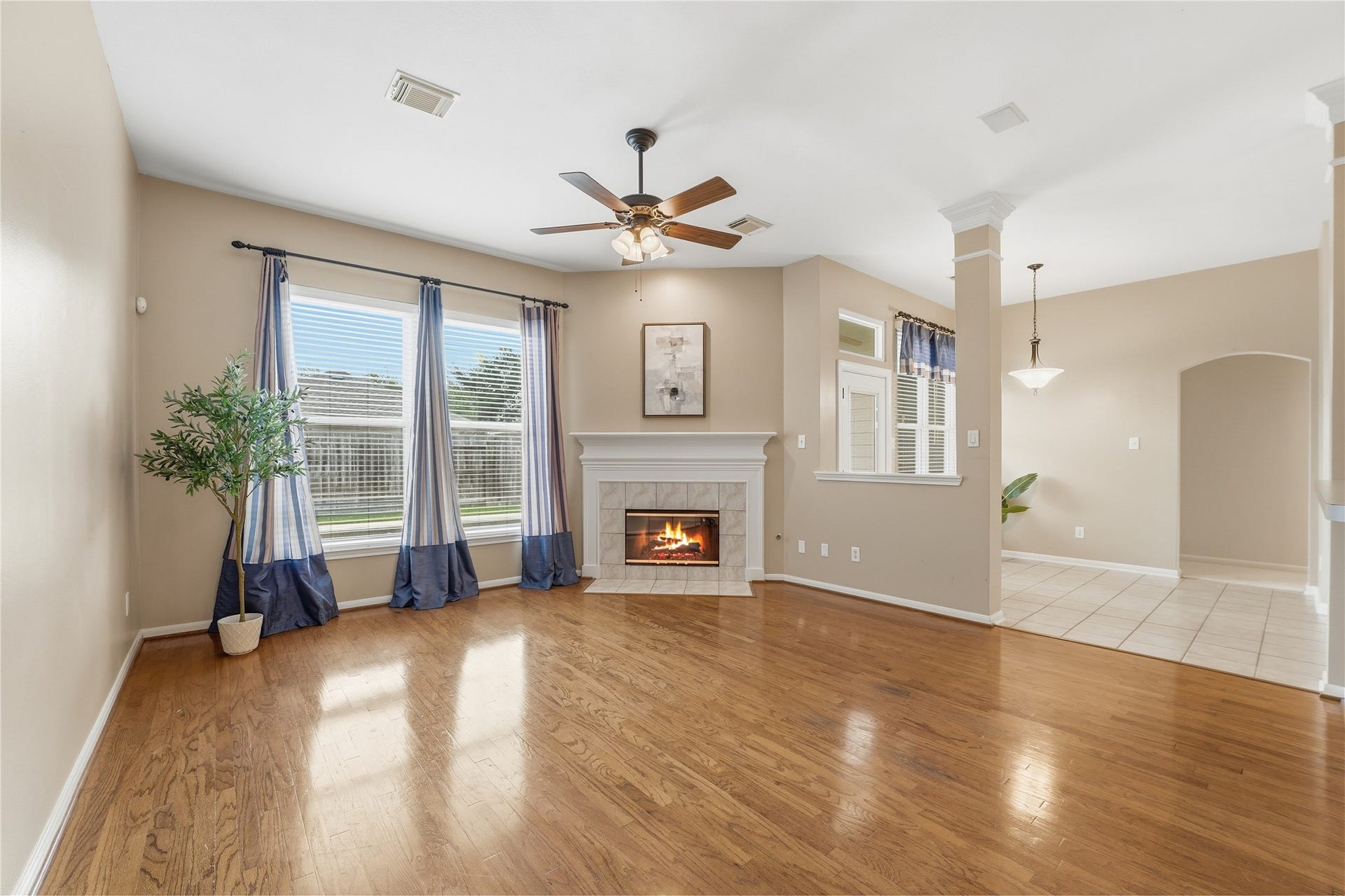 8027 Summer Brook Court, Sugar Land, TX 77479 Den with fireplace overlooks the backyard pool