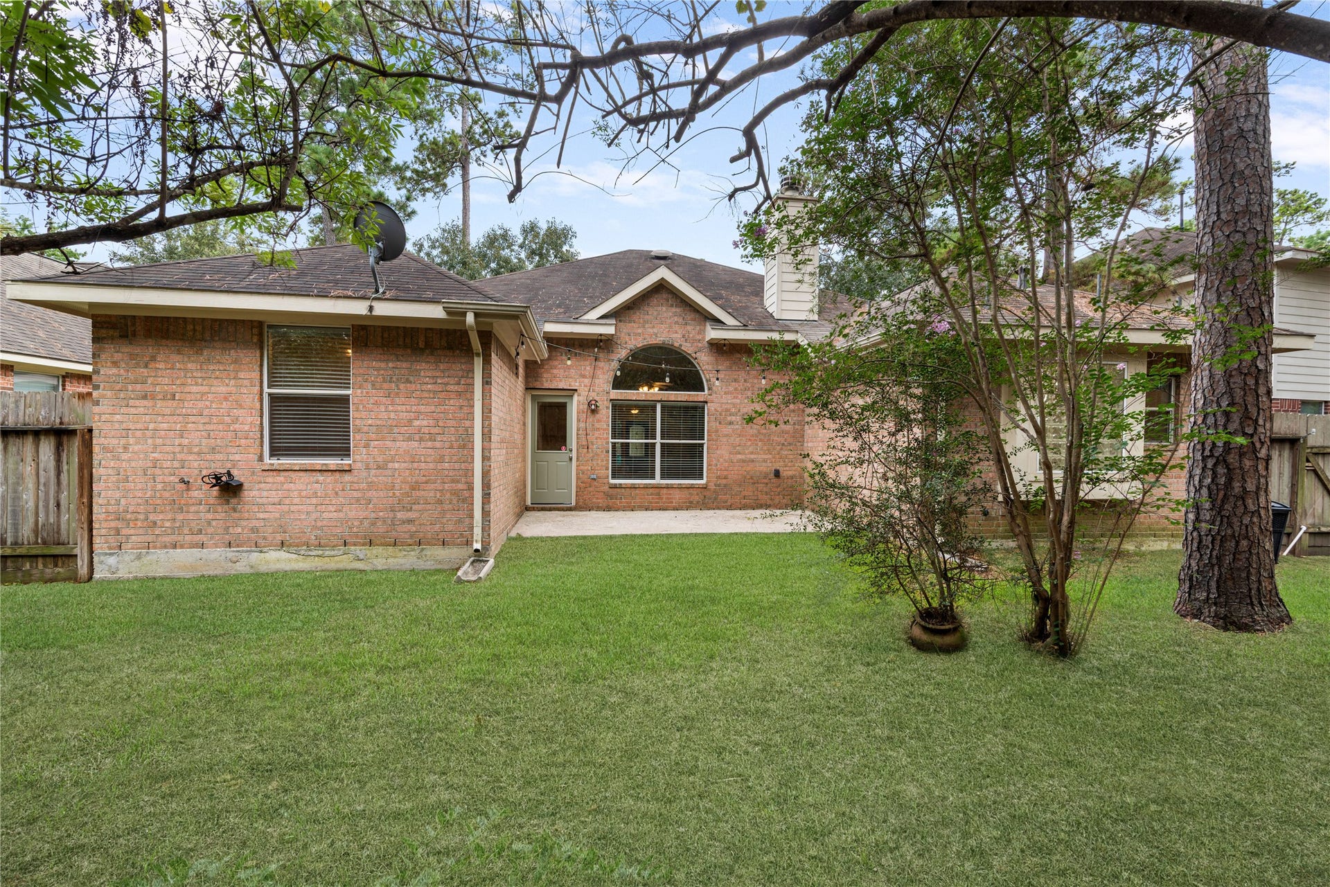 66 Bryce Branch Circle, Spring, TX 77382 Charming brick exterior home with brick on all 4 sides, has a spacious backyard, perfect for outdoor enjoyment. Surrounded by mature trees, the yard offers both privacy and shade.