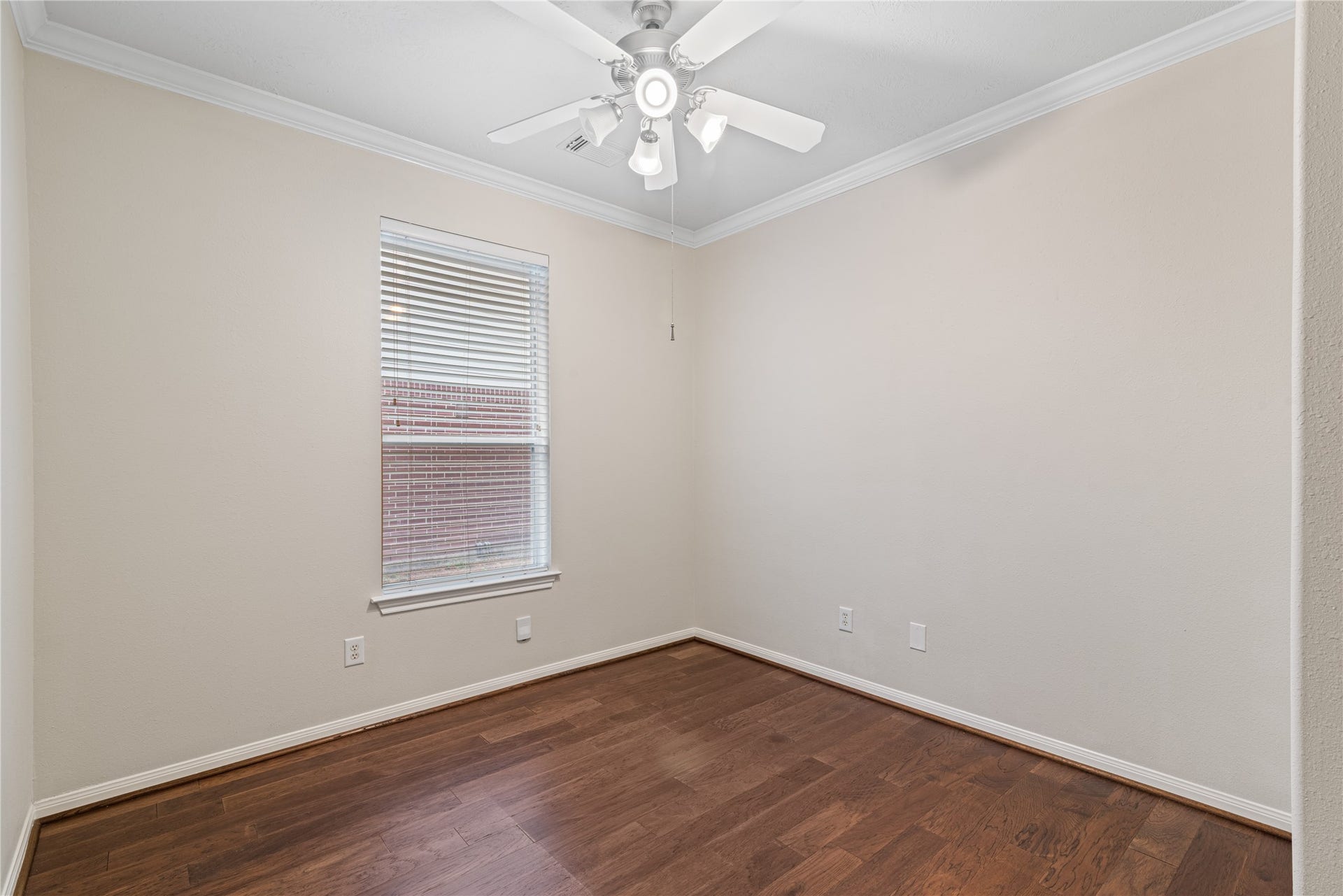 66 Bryce Branch Circle, Spring, TX 77382 Charming room with neutral walls and abundant natural light from a large window, complete with a ceiling fan for comfort. This could be a home office or flex room.