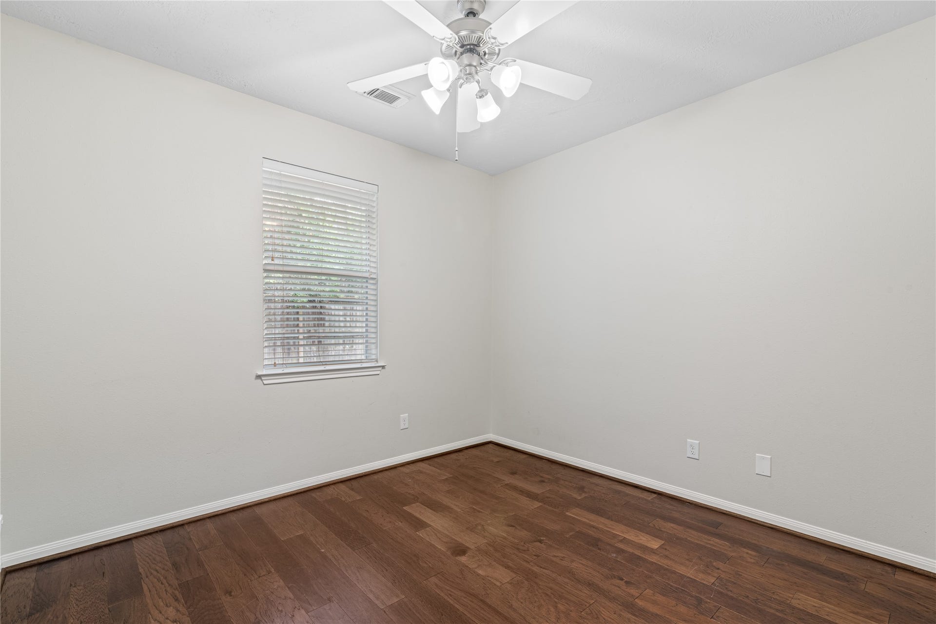 66 Bryce Branch Circle, Spring, TX 77382 3rd Bedroom is bright with neutral walls, and a ceiling fan.