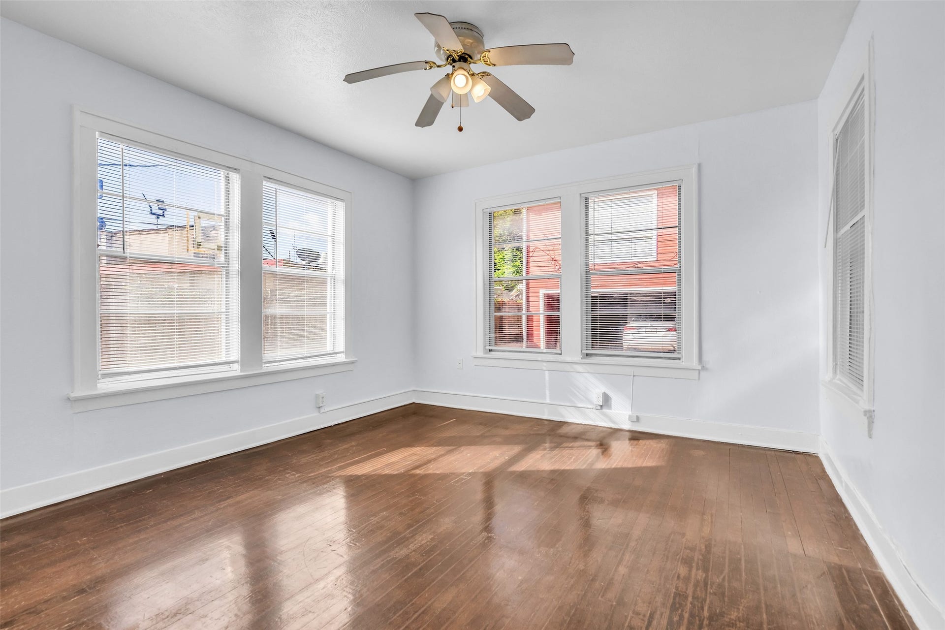 The first-floor secondary bedroom receives plenty of natural light and features a ceiling fan for comfortable airflow. A wardrobe provides additional storage, adding to the rooms functionality.