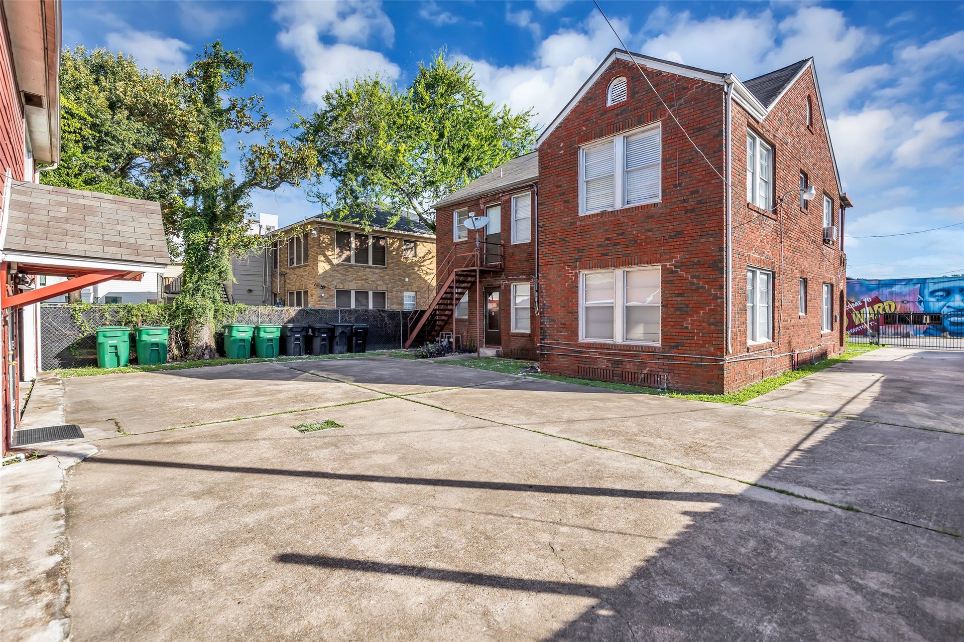 The property includes generous outdoor space with plenty of room for parking, providing convenient access for residents and guests.