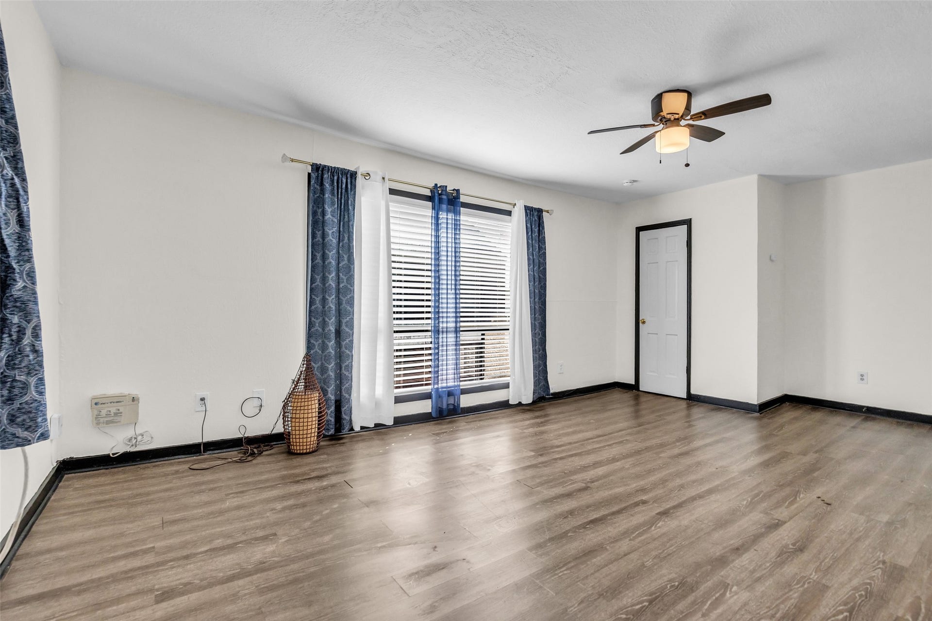 The second unit living room is spacious and well-lit, providing a comfortable area for relaxing, entertaining, or spending time with family and guests.